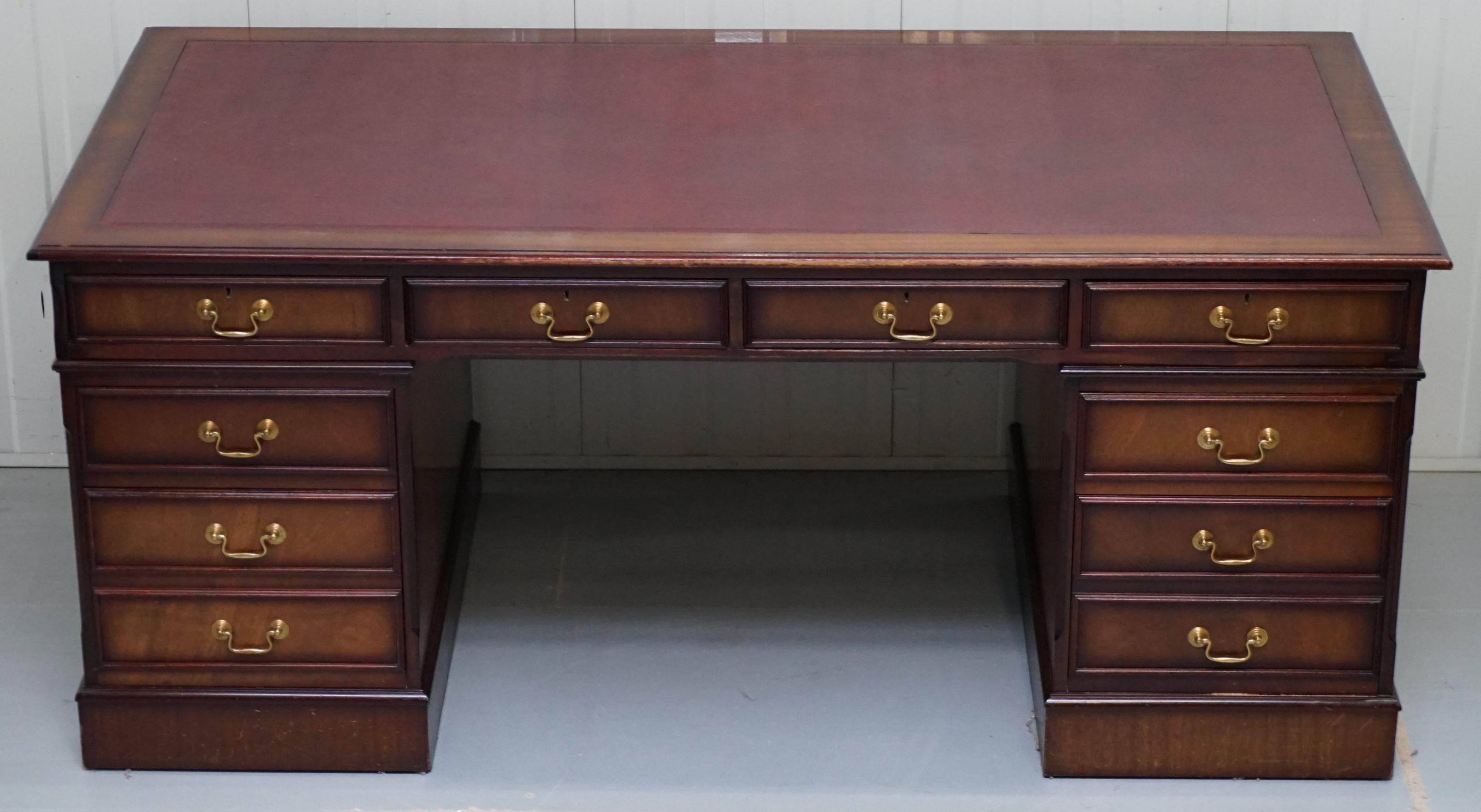We are delighted to offer for sale this lovely extra leg room twin pedestal partner desk with oxblood leather top and mahogany frame,

A very well made piece, this desk has four drawers across the top instead of three, the end result is you have
