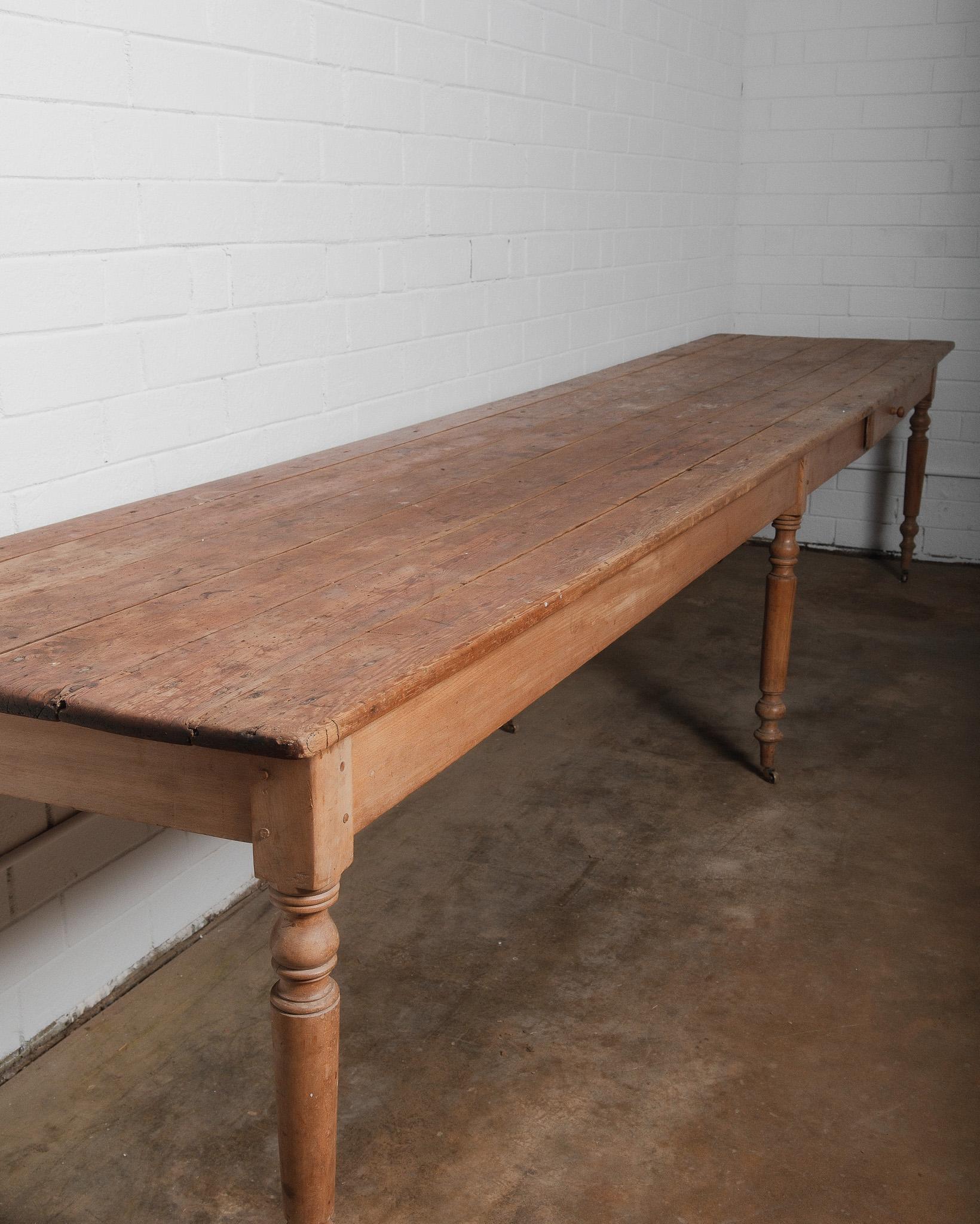 Rustic Extra-Long 19th Century French Pine Farmhouse Table with Drawers and Casters For Sale