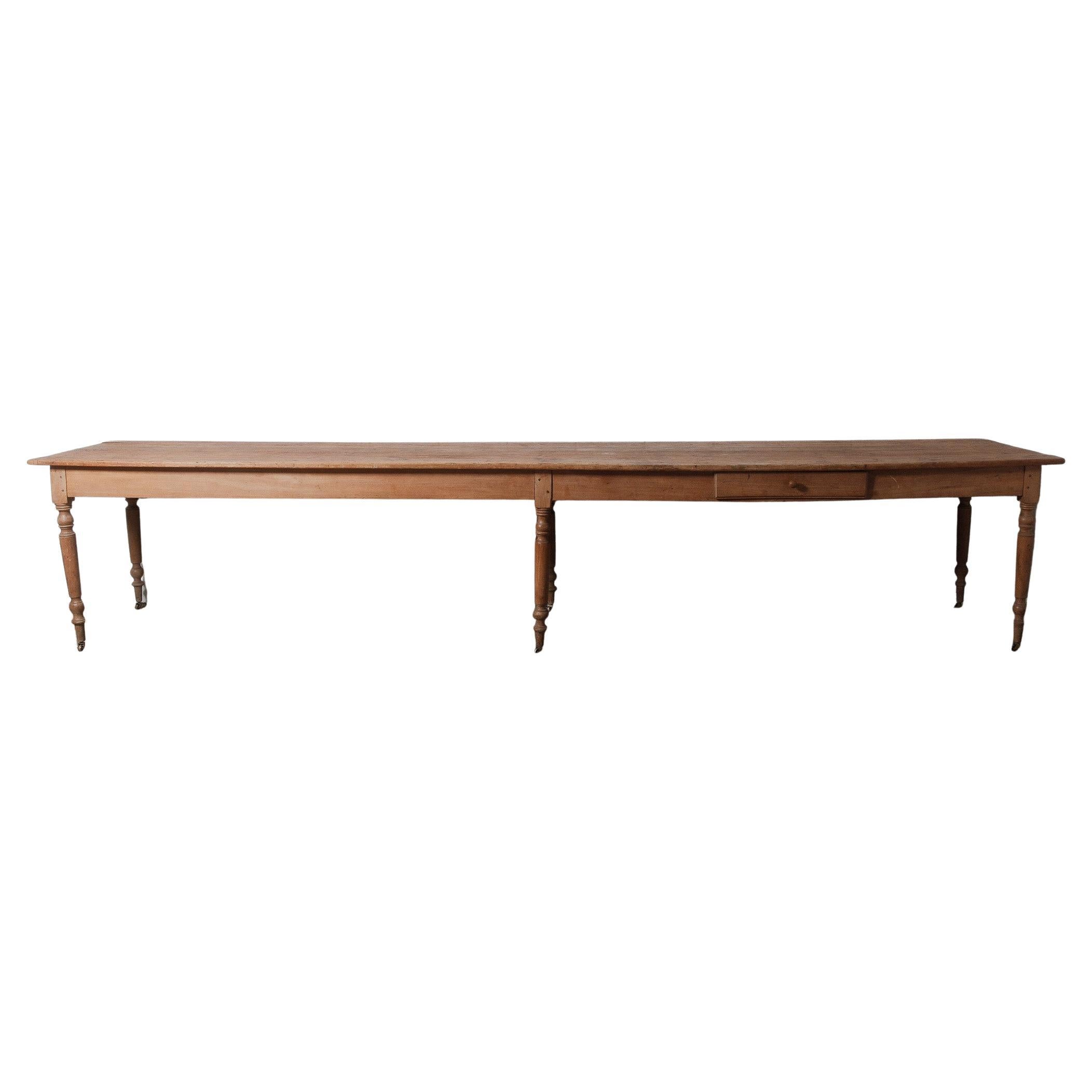Extra-Long 19th Century French Pine Farmhouse Table with Drawers and Casters For Sale