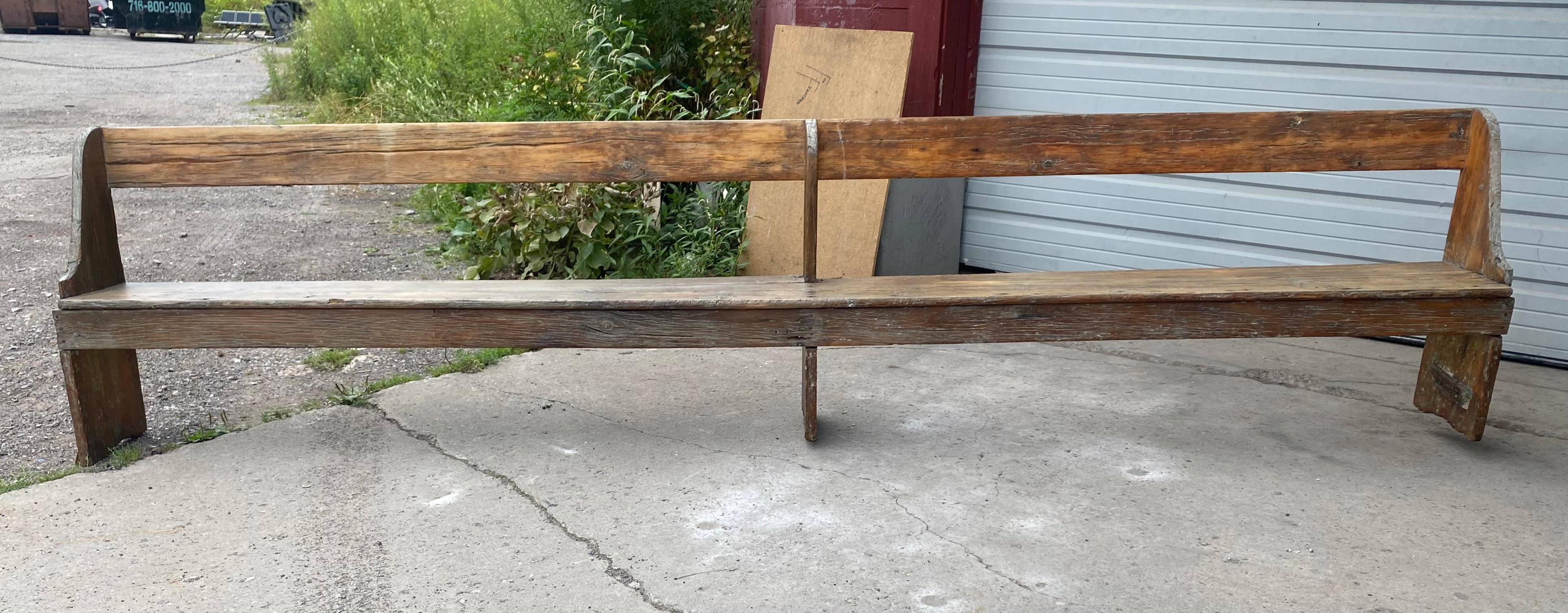 Extra long 19th Century single plank primitive bench, over 11 foot long. In Distressed Condition In Buffalo, NY