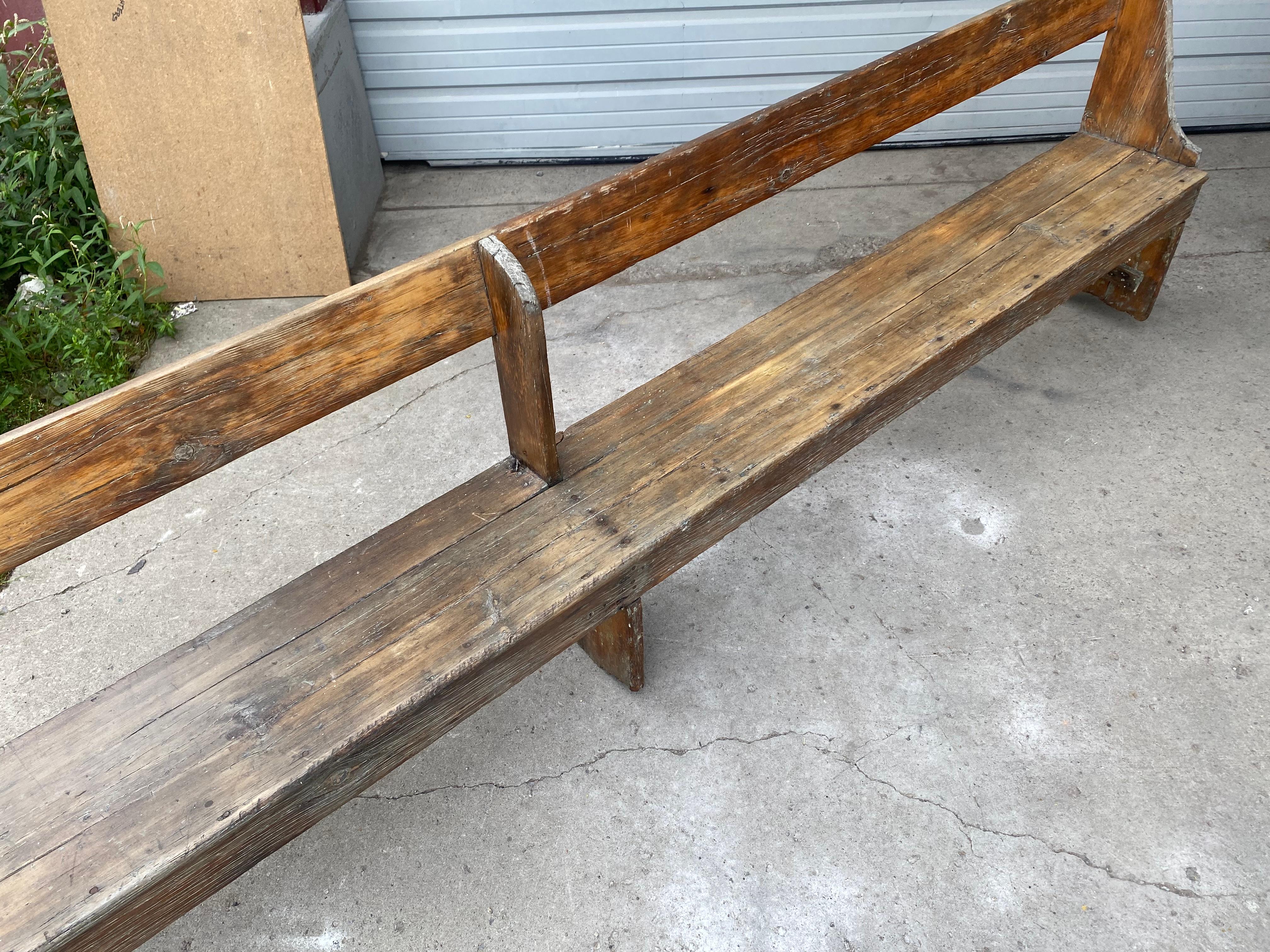 Wood Extra long 19th Century single plank primitive bench, over 11 foot long.
