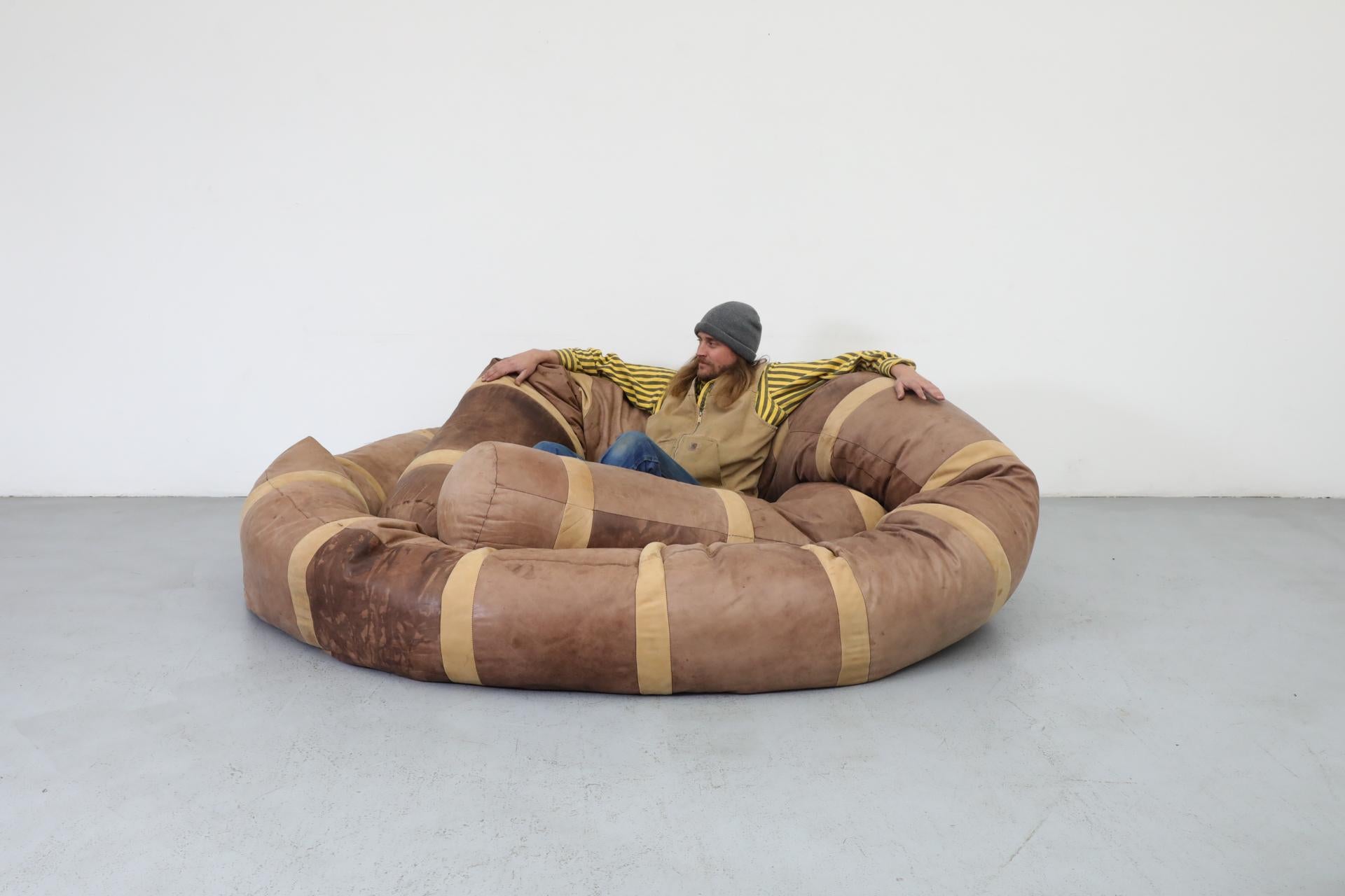 XL leather snake beanbag sofa, designed by Hans Roebers in the 1970s, measuring 36 feet in length. Today, Roebers is mostly recognized as a celebrated multidisciplinary artist and architect, but in the early years of his lengthy and illustrious