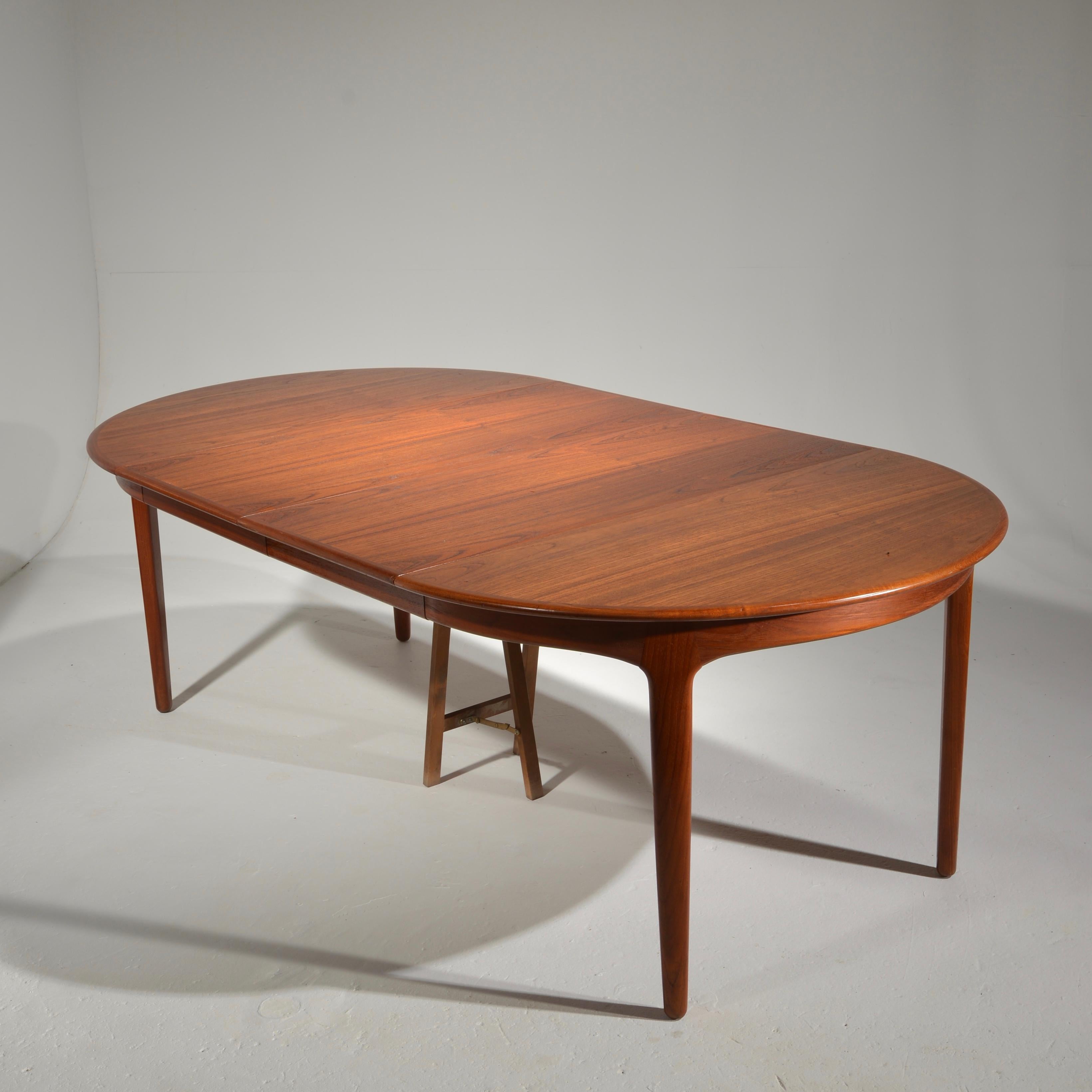 Extra Long Danish Teak Round Table with 4 Extensions by Henning Kjaernulf 1