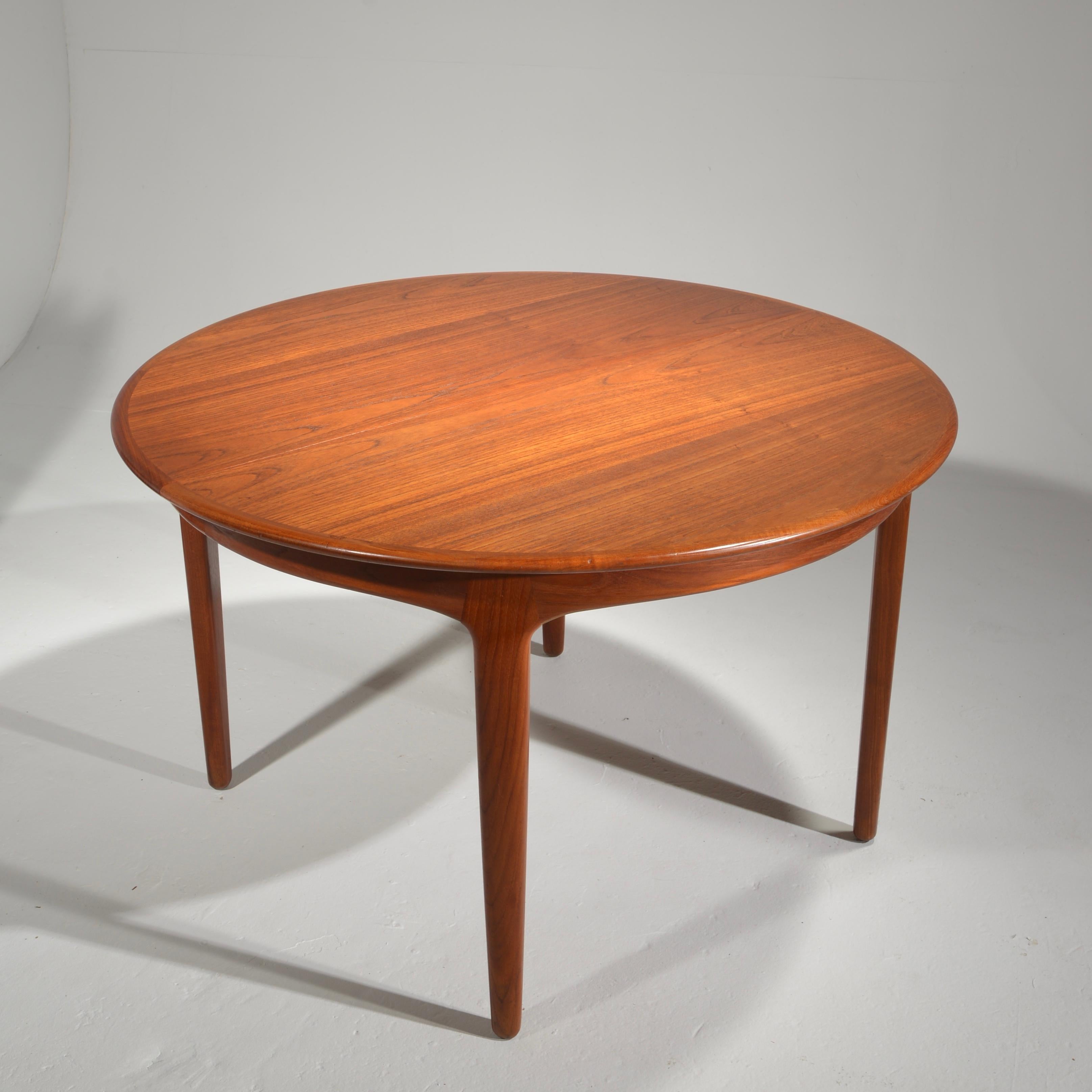 Extra Long Danish Teak Round Table with 4 Extensions by Henning Kjaernulf 4