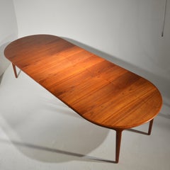 Extra Long Danish Teak Round Table with 4 Extensions by Henning Kjaernulf