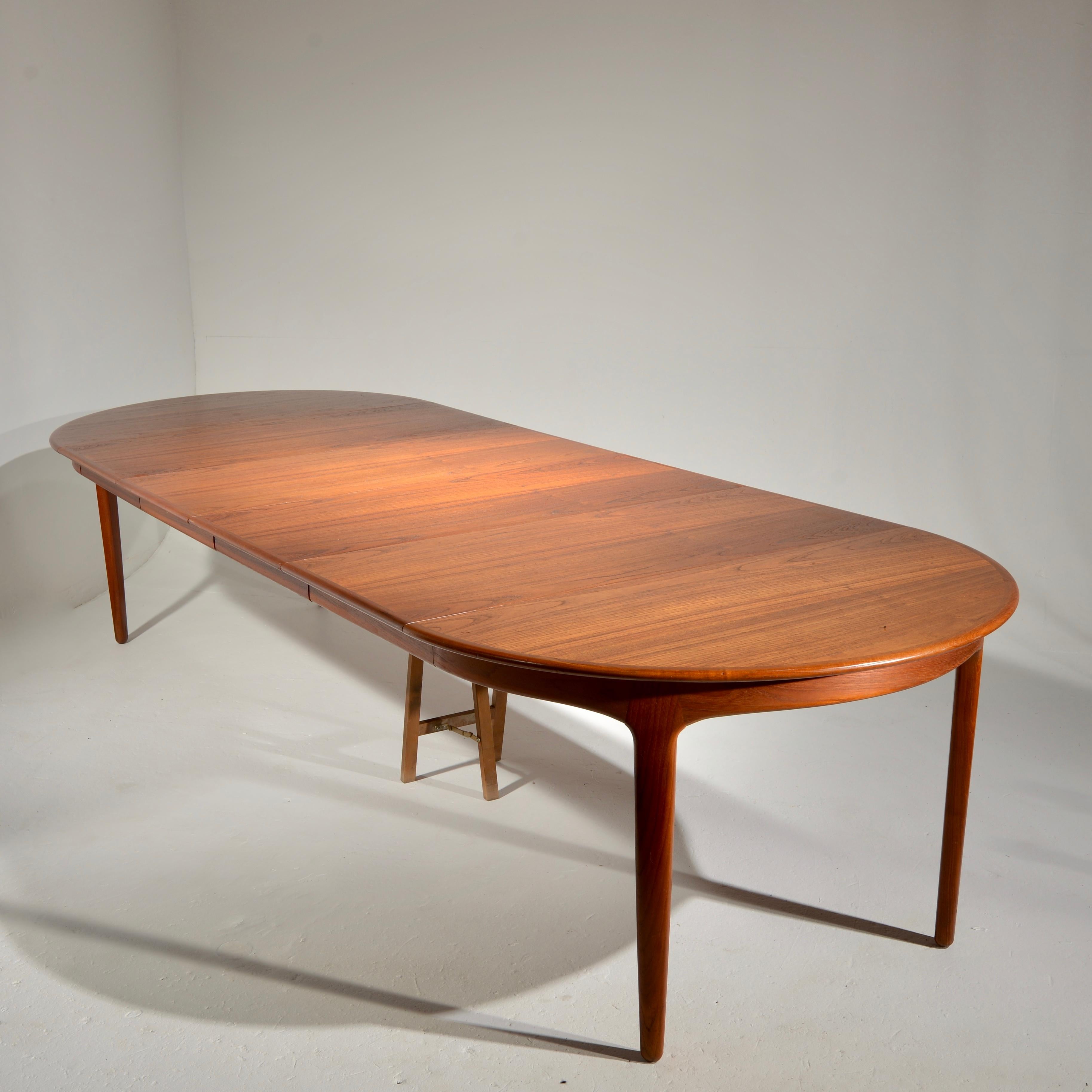 Scandinavian Modern Extra Long Danish Teak Round Table with 4 Extensions by Henning Kjaernulf