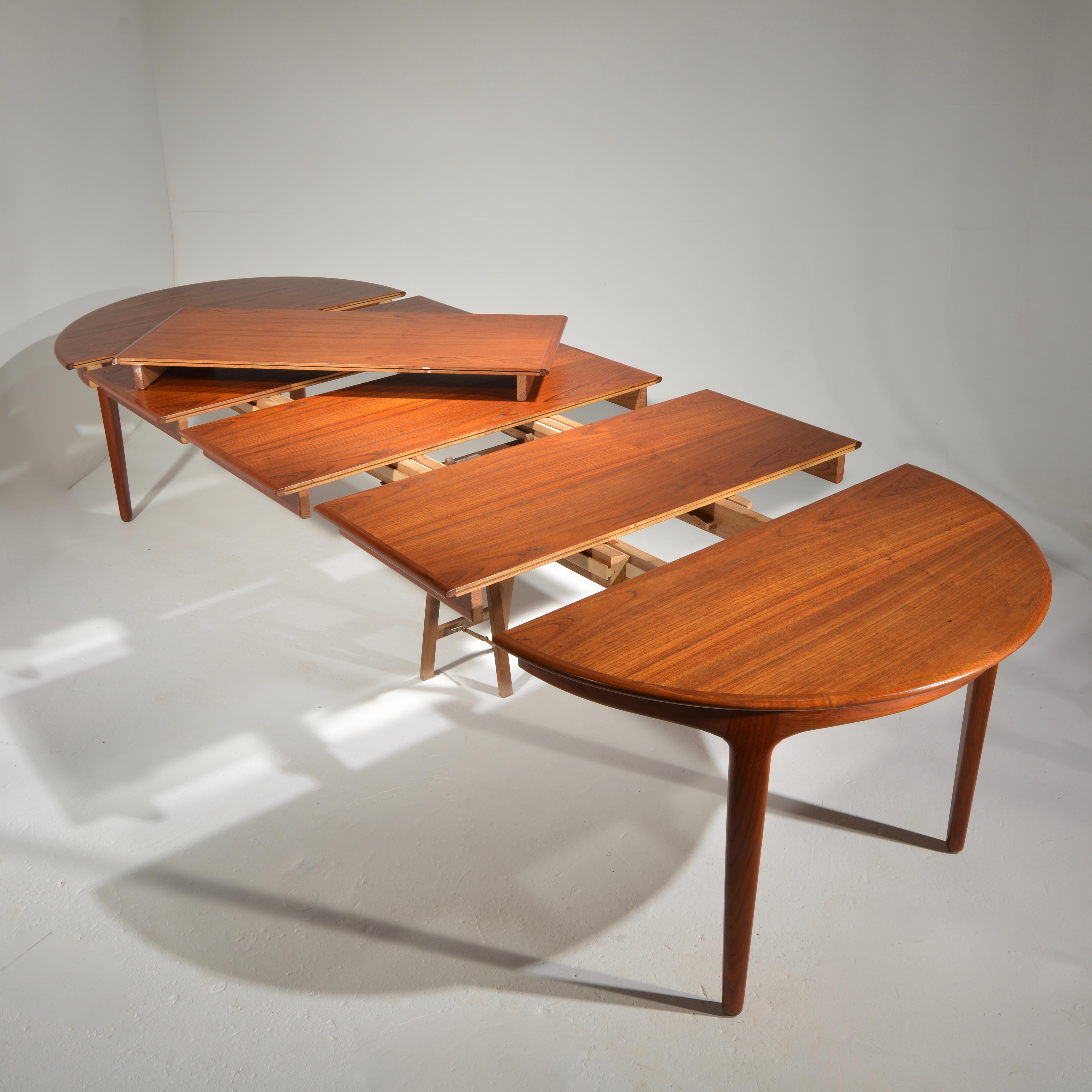 Mid-20th Century Extra Long Danish Teak Round Table with 4 Extensions by Henning Kjaernulf