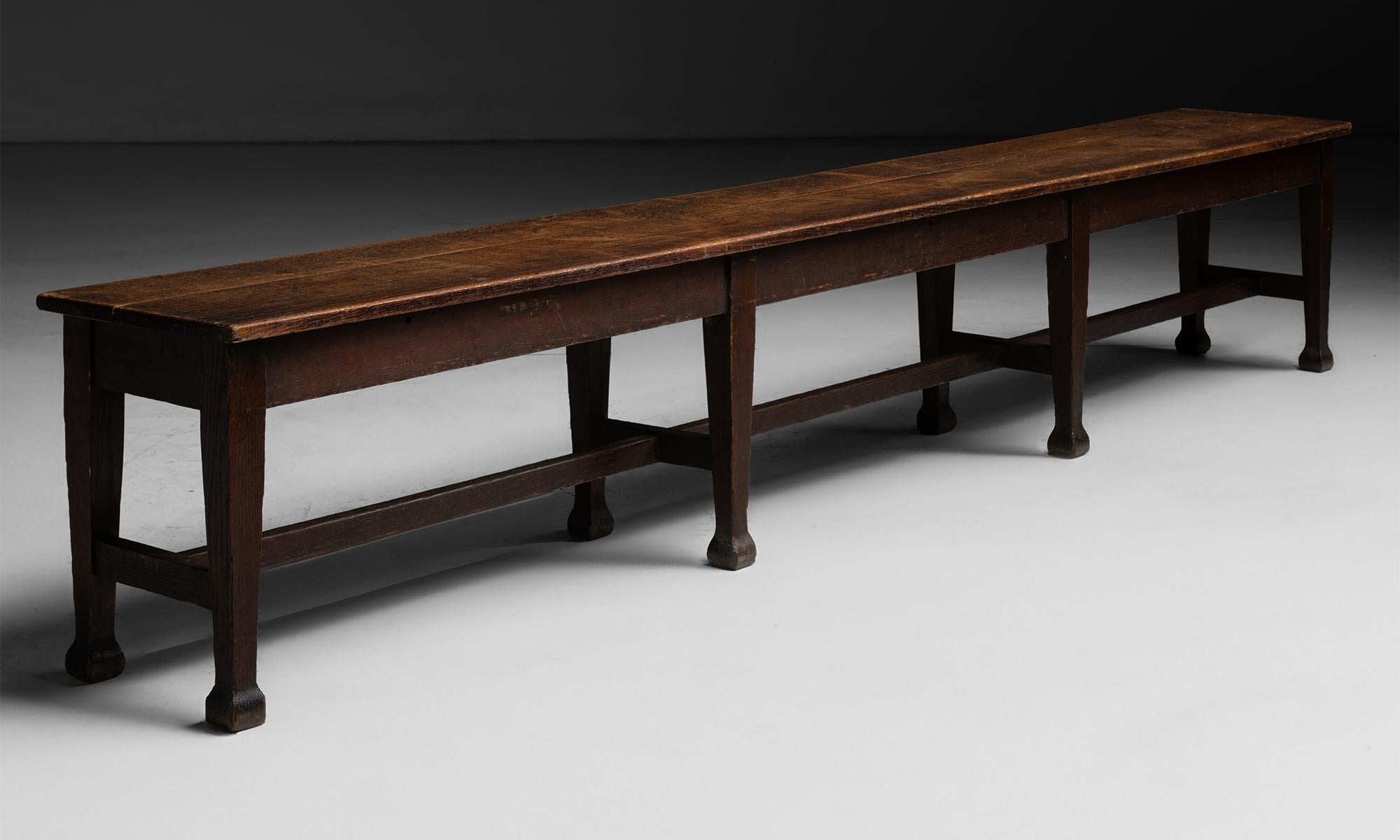 England circa 1890

8 Leg hall bench constructed in oak, with plank top and tapered legs.

08”L x 15”d x 19”h