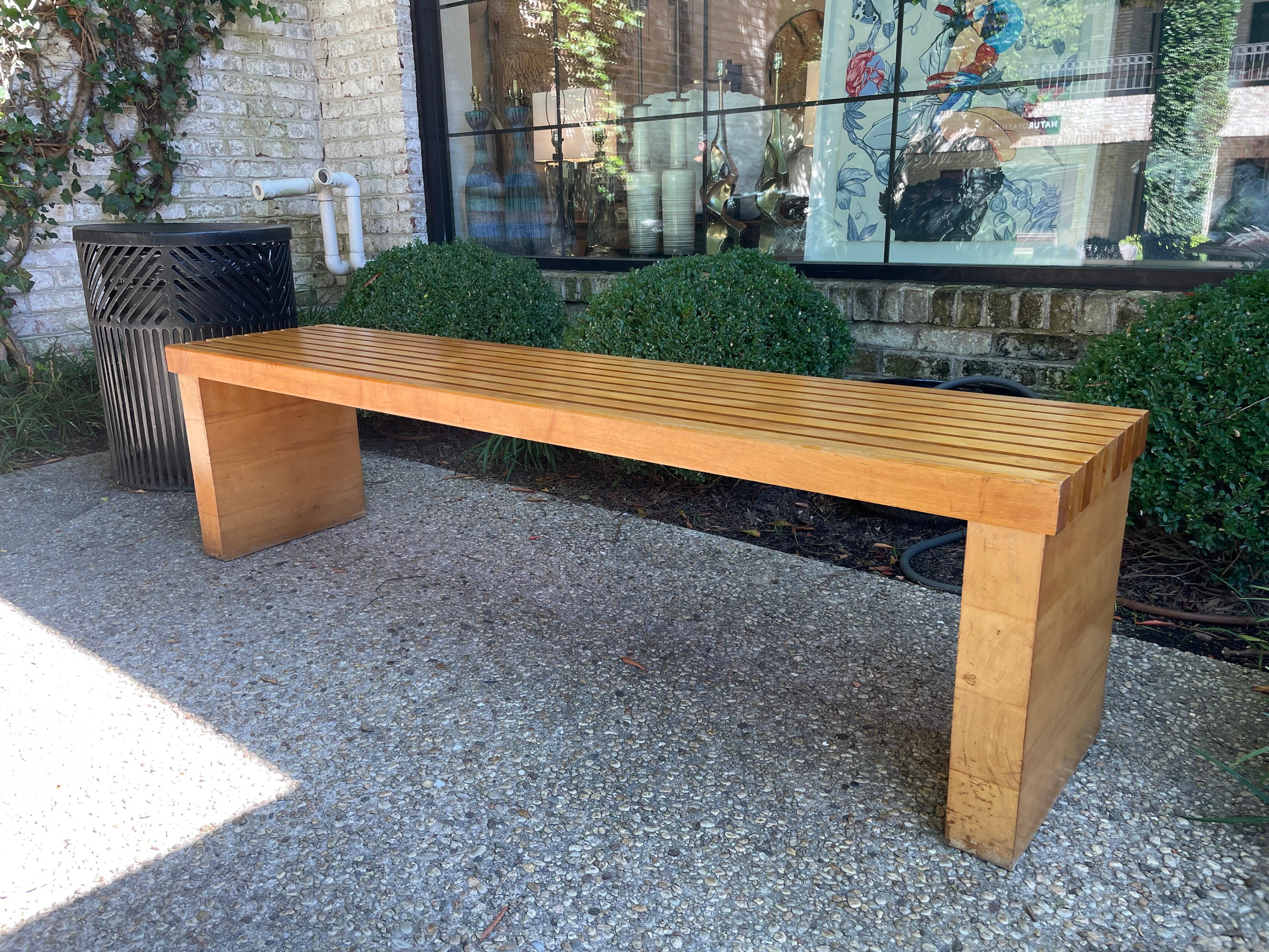 A French extra long thick block maple wood slatted bench in the Charlotte Perriand style.