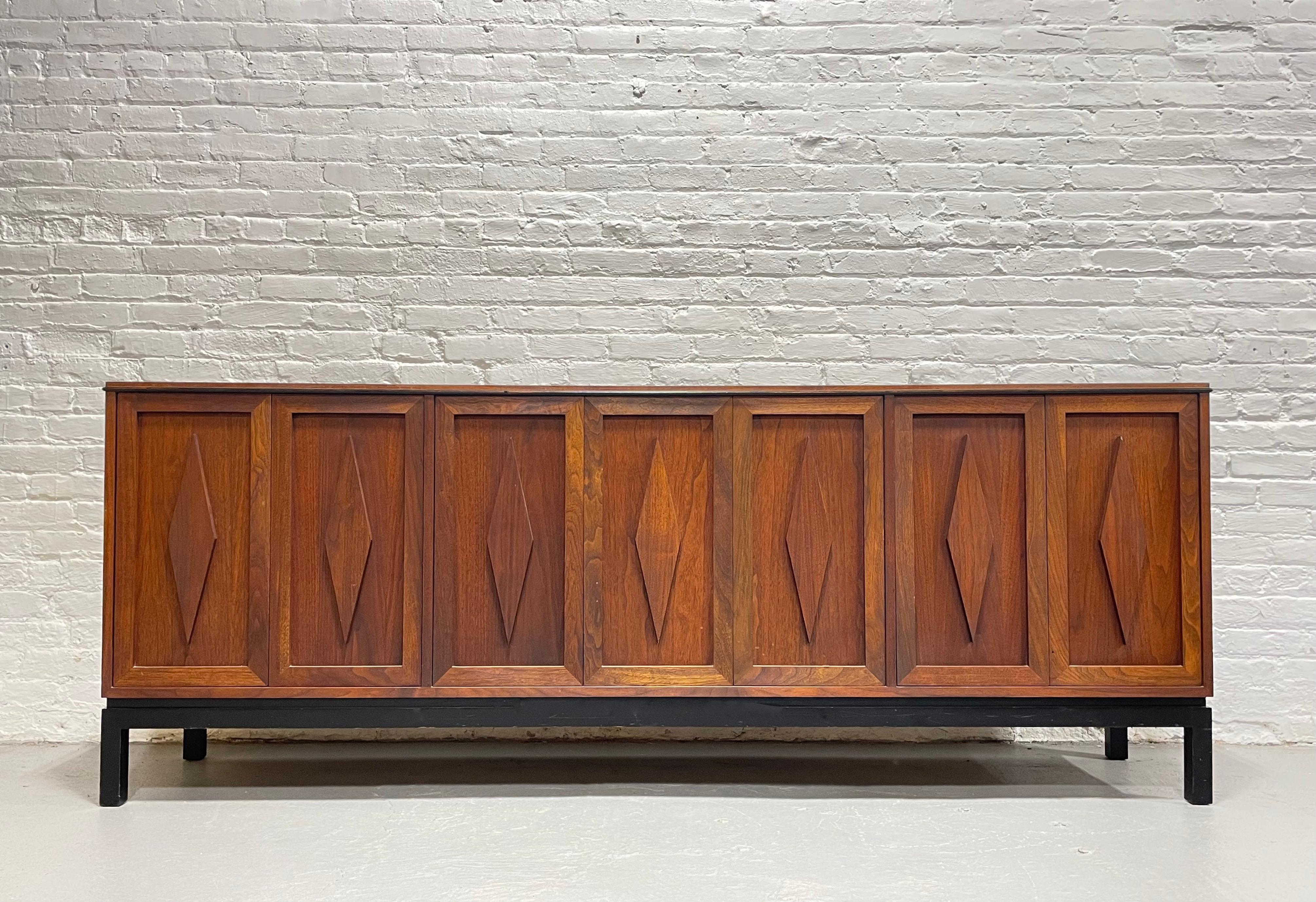 Extra long Mid Century Modern Walnut credenza / media stand offering a wealth of storage and the most stunning diamond pattern across the facade. This beautifully crafted piece is perfect as a media stand with plenty of interior adjustable or