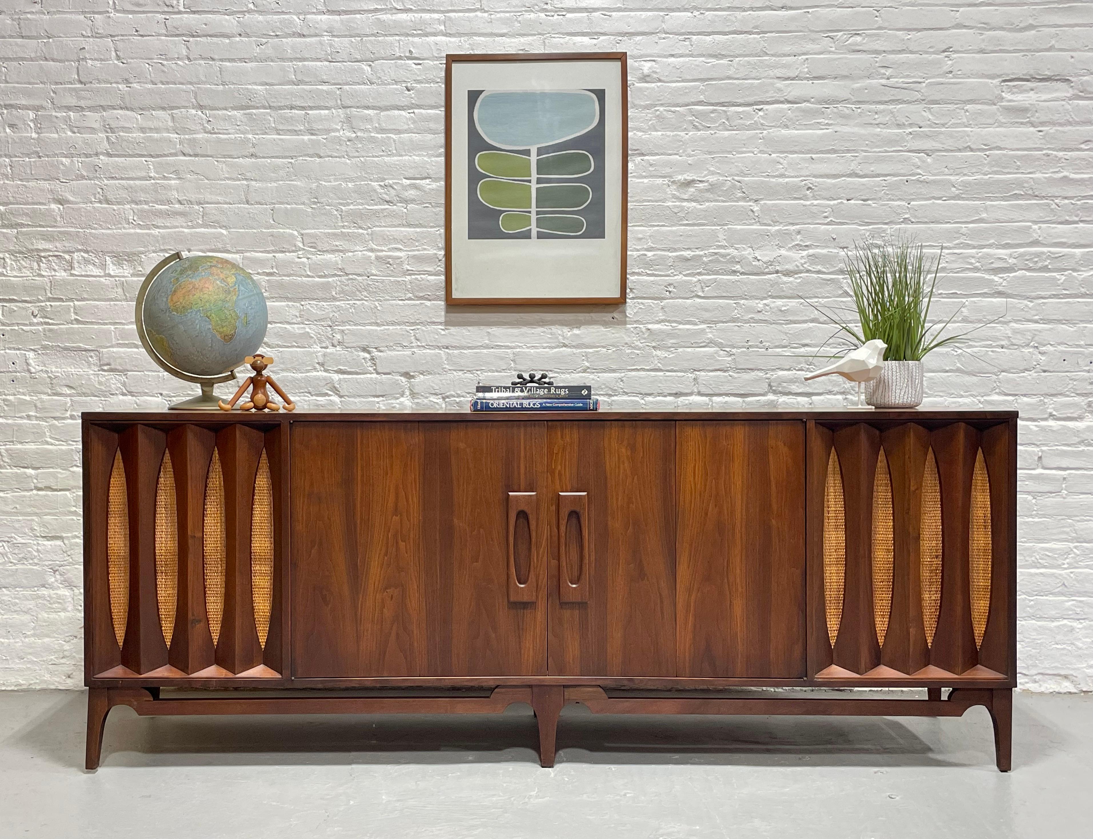 Extra Long and superbly incredible Mid Century Modern Stereo Cabinet / Credenza, c. 1960's. This custom made walnut sideboard is truly one of a kind and will fill your wall like no other. The credenza is flanked by two speaker storage cabinets on