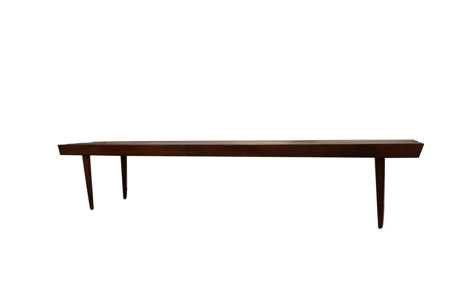 Extra long mid century slatted wood bench coffee table in George Nelson style. Amazing Mid-Century Modern George Nelson style slat bench coffee table. Classic slat wood coffee table bench. This table is exceptionally well made. Features clean lines