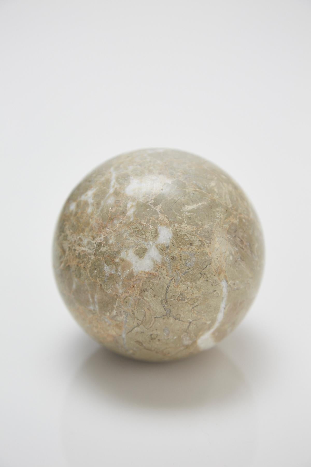 Extra small decorative sphere measuring 3.5 in. diameter. Solid beige/gray stone sphere with flattened end for balance.

All furnishings are made from 100% natural Fossil Stone or Seashell inlay, carefully hand cut and crafted piece-by-piece and