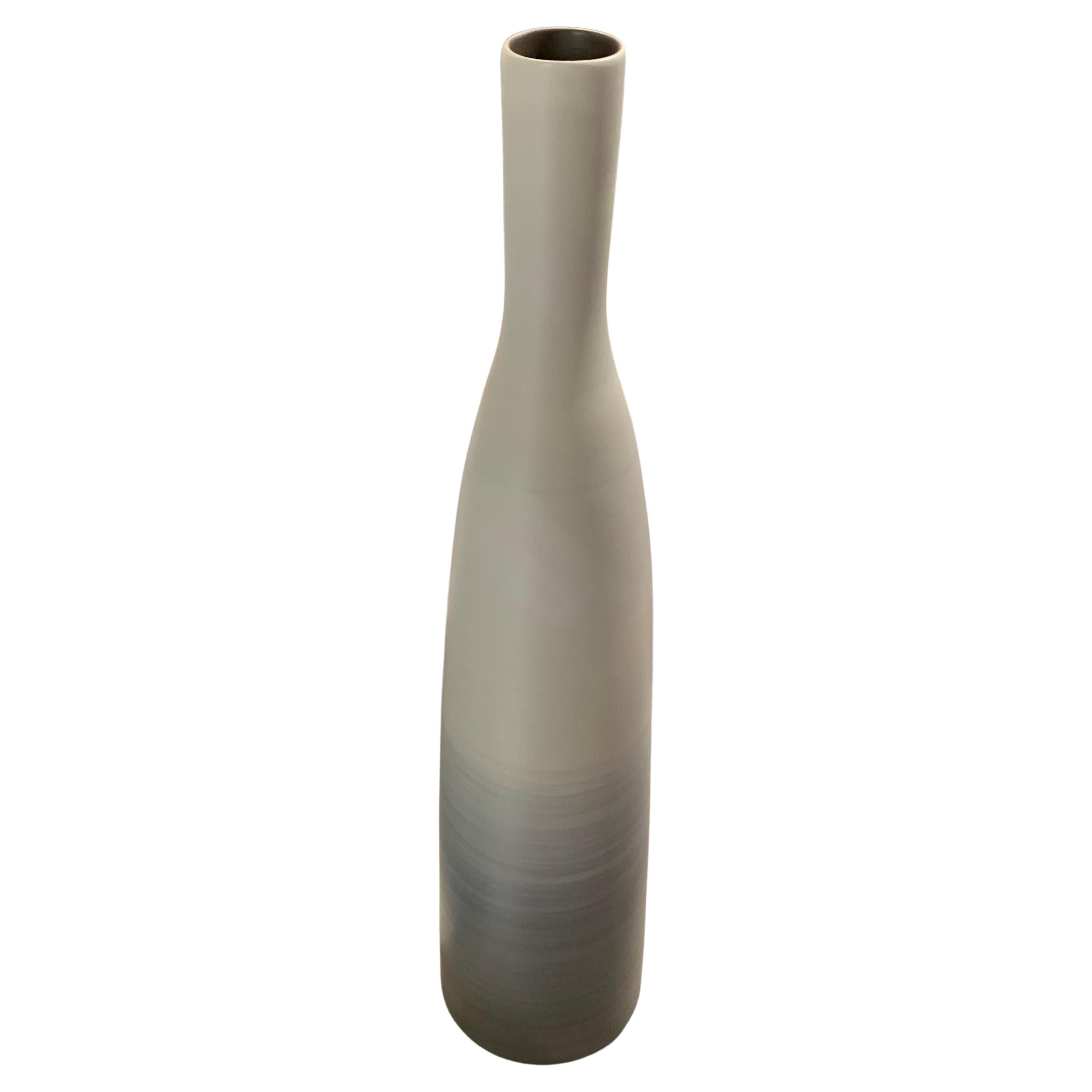 Contemporary Italian tall thin vase with decorative ombre glaze.
Shades of turquoise and grey at the bottom, ascending to solid pale taupe above.
Available in three sizes ( S6197 S6198 )
Together make an attractive presentation.