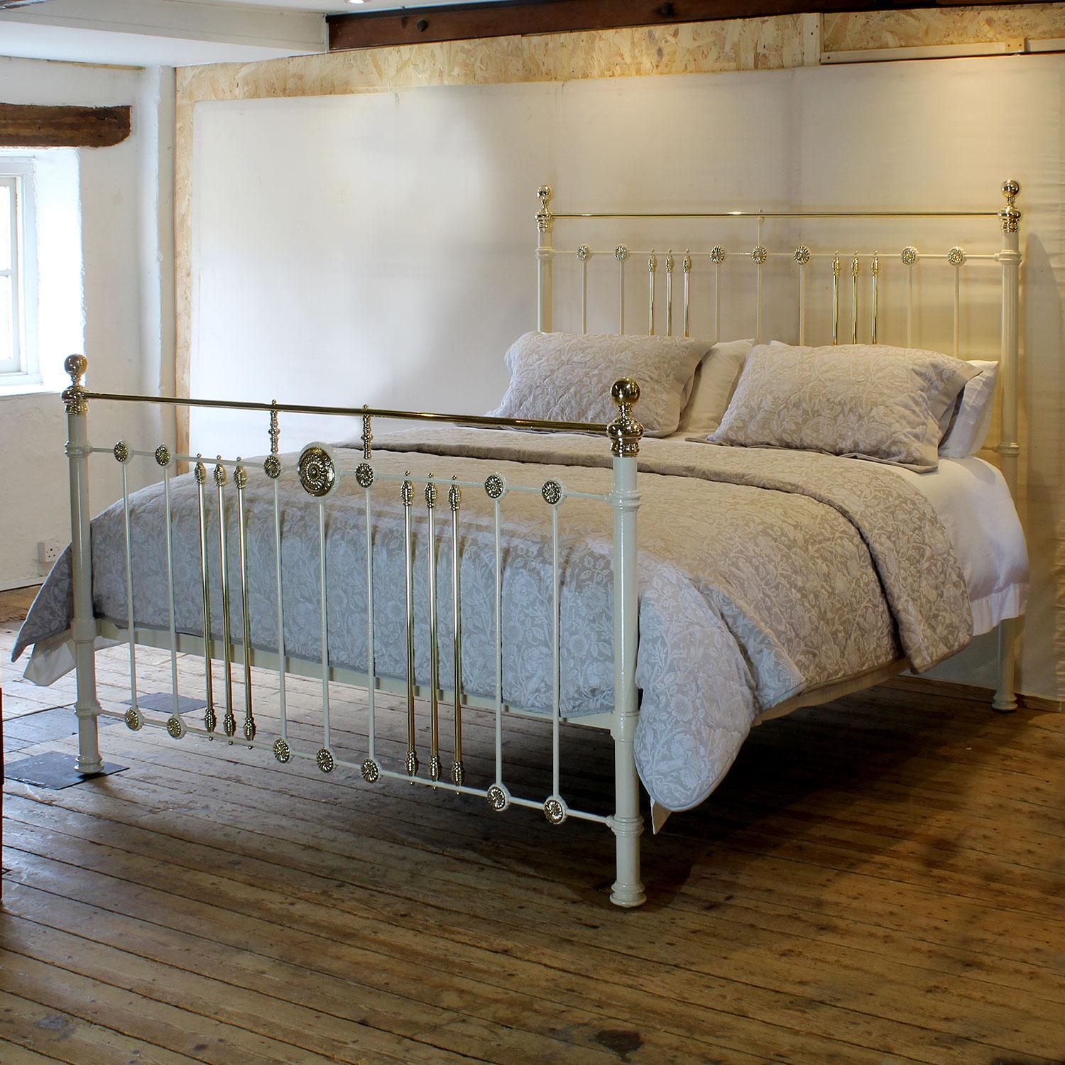 An attractive 6ft wide (72 inches) brass and iron antique bed finished in cream with brass rosette decoration and straight brass top rail, adapted and extended from an original Victorian frame, circa 1895.

This bed accepts a UK Super King or