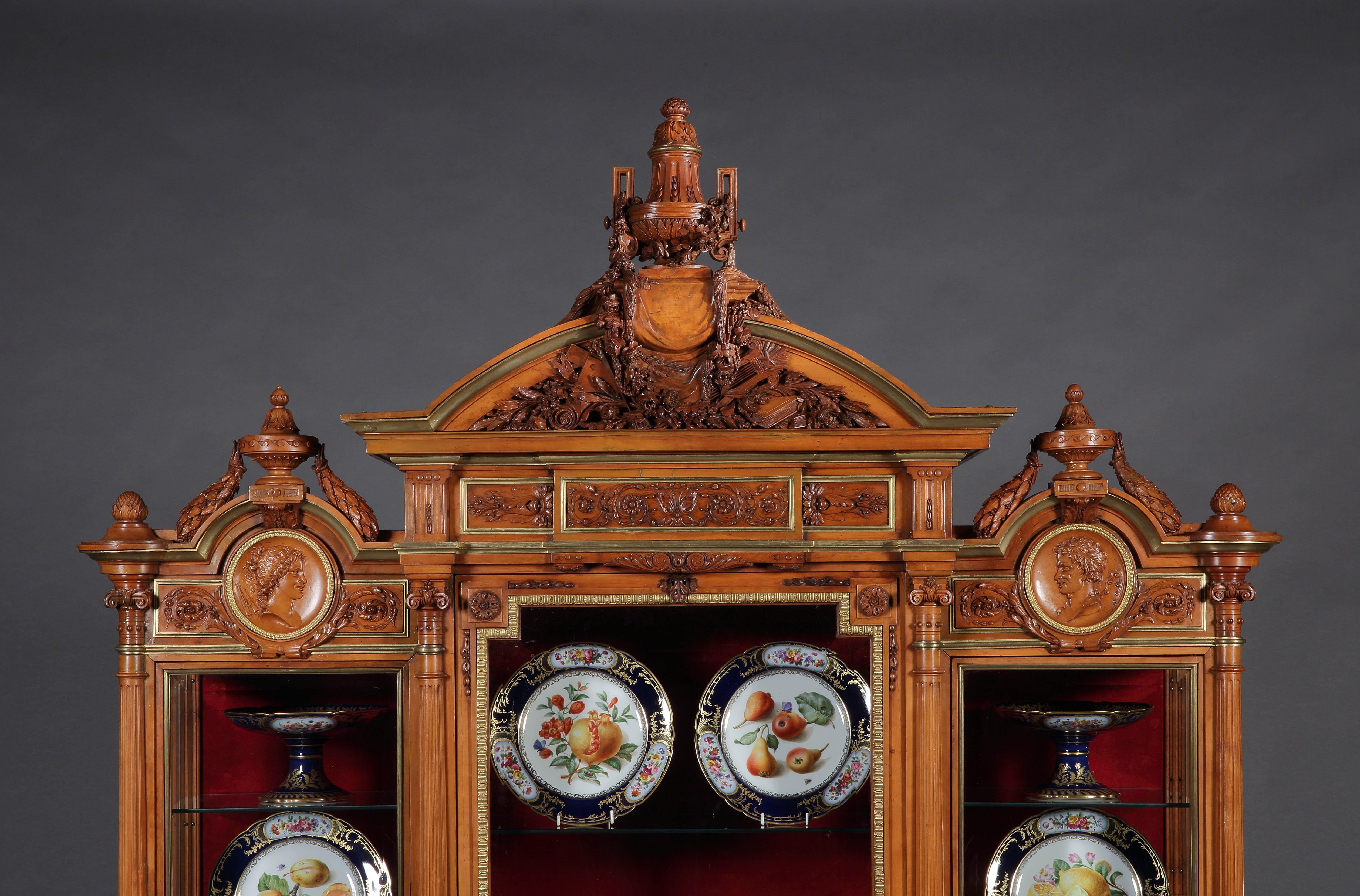 An Important Napoleon III Exhibition-Quality
Ormolu-Mounted Carved Cabinet
By Maison Guéret of Paris

A tour-de-force glazed boxwood cabinet celebrating the art of woodcarving, the monumental vitrine of slight breakfront proportions, with