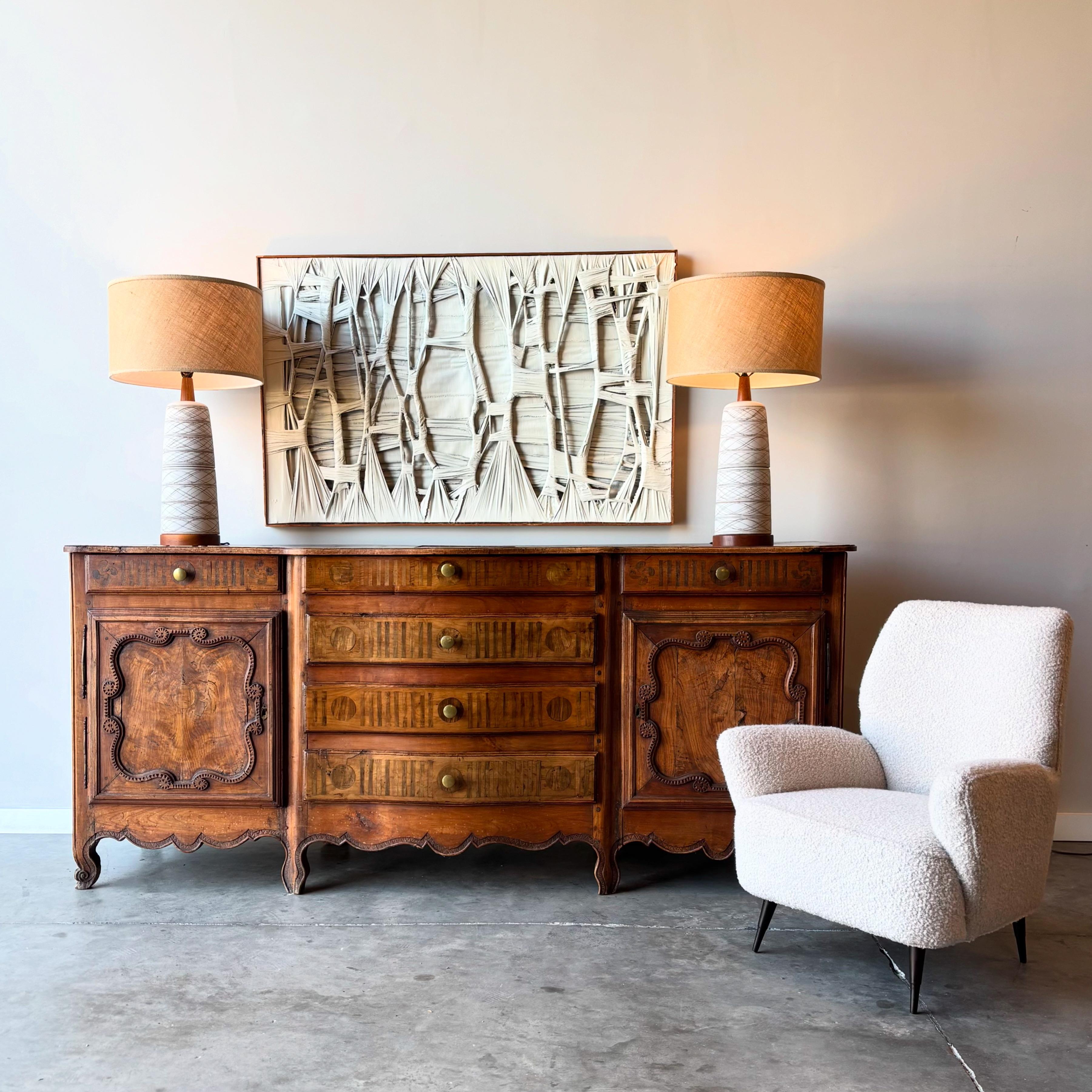 A stunning antique buffet dating to the 1800's.  Solid walnut construction with rosewood inlay.  Mortise and tenon with dowels to secure, the details throughout show beautifully.  Raised upon eight cabriole legs with scalloped base trim. Central bay