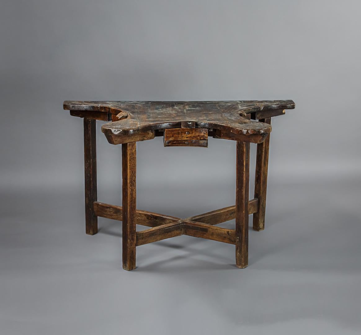 Early 19th century jewelers table, workstation for three craftsmen, each with a small drawer to catch any falling precious metals. Wonderful patina to the fruitwood surface. Makes an unusual home office workstation.
 