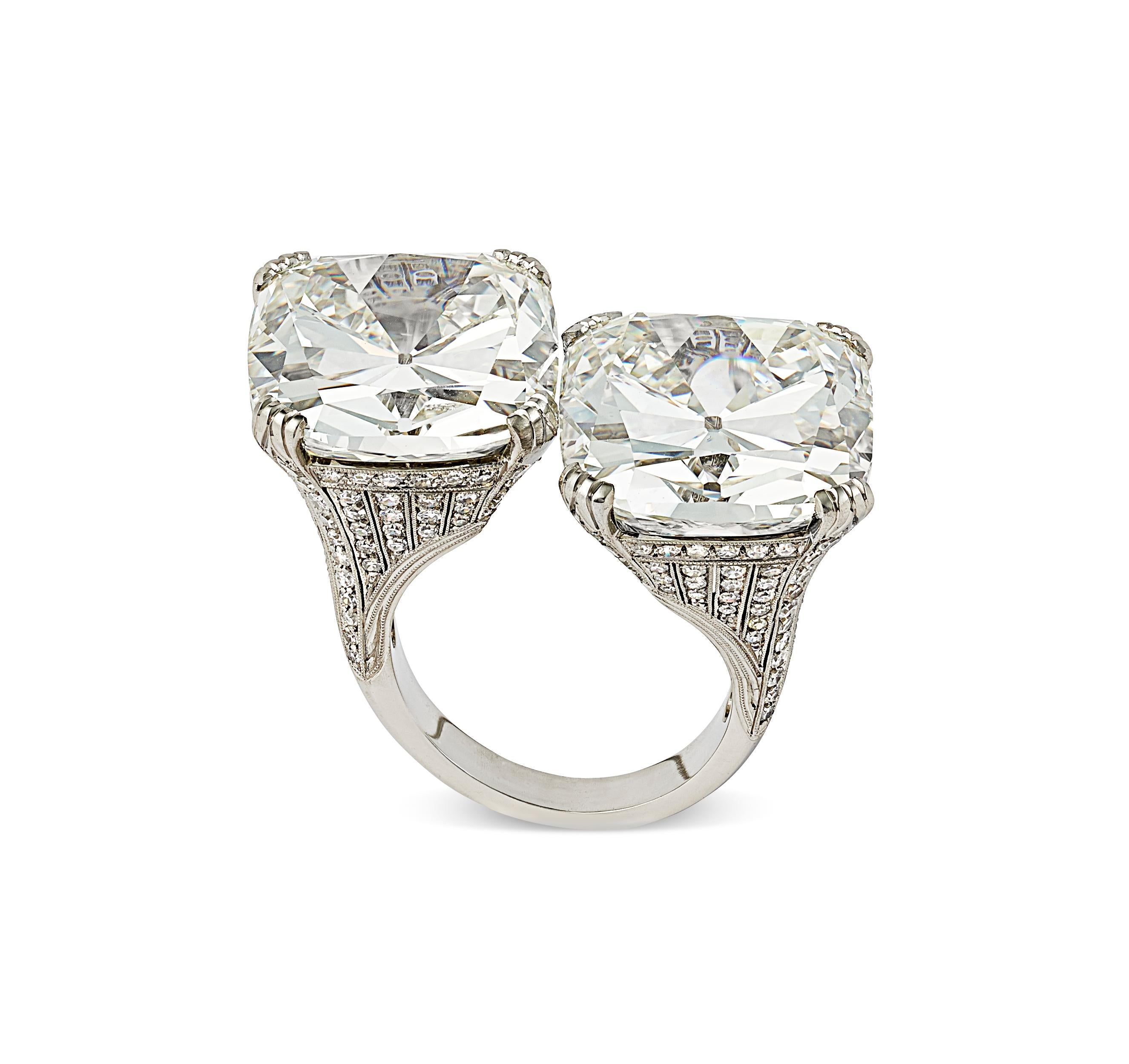 Extraordinary one of the World's largest Cushion cut diamond Crossover rings - 21.24 carats & 20.54 carats by Hancocks.
The exceptional pair of cushion cut diamonds are both K colour and VS2 and SI1 clarity, claw set in a handcrafted finely pierced
