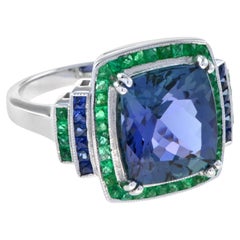 Extraordinary 6.56 Carats Cushion Tanzanite with Emerald and Sapphire Halo Ring