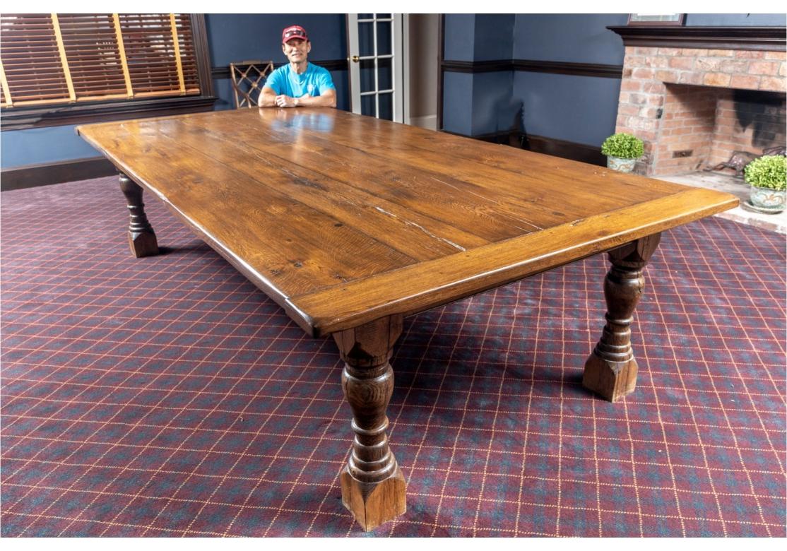 Outstanding and large Harvest table in solid Oak with handsome grain and a fine  polish. The Bread Board top is peg constructed  and the top is made of five wide board planks.  

30 1/4