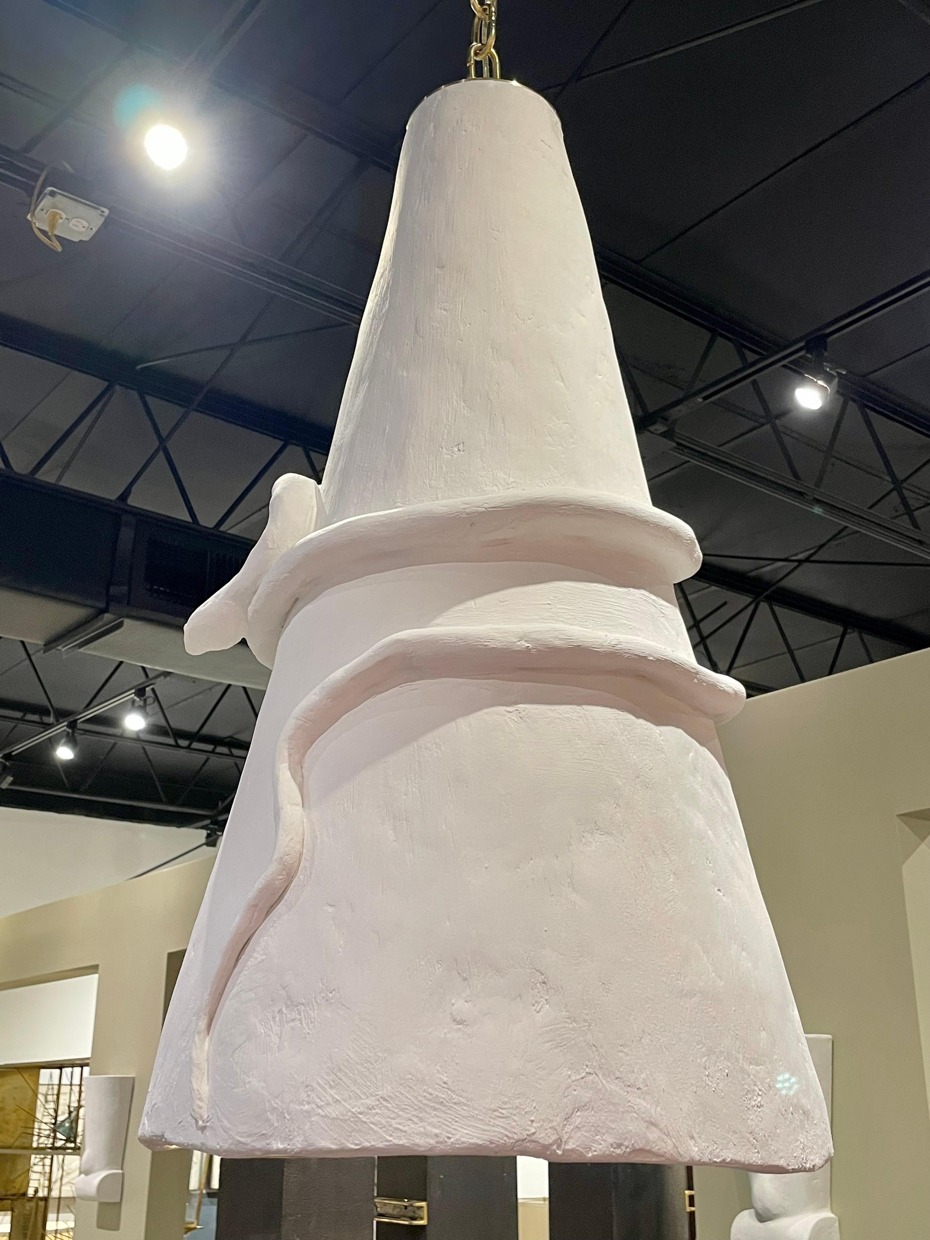 This is whimsical and beautiful with a large conical pendant flaring out. One edison bulb to interior provides ample light. The serpent wrapped to exterior is also made of plaster and just adds so much interest in this organic and simple designed