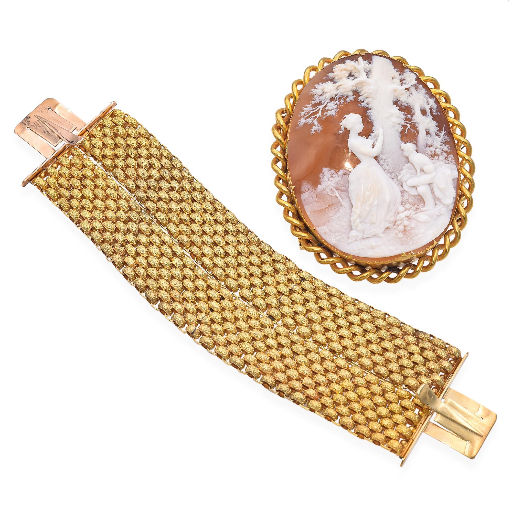 This remarkable piece showcases a detailed sardonyx cameo of a young girl, Julie, carving into a tree while her loyal dog watches. Julie is the central figure from Jean-Jacques Rousseau's novel Julie, or the New Heloise, which tells the poignant,