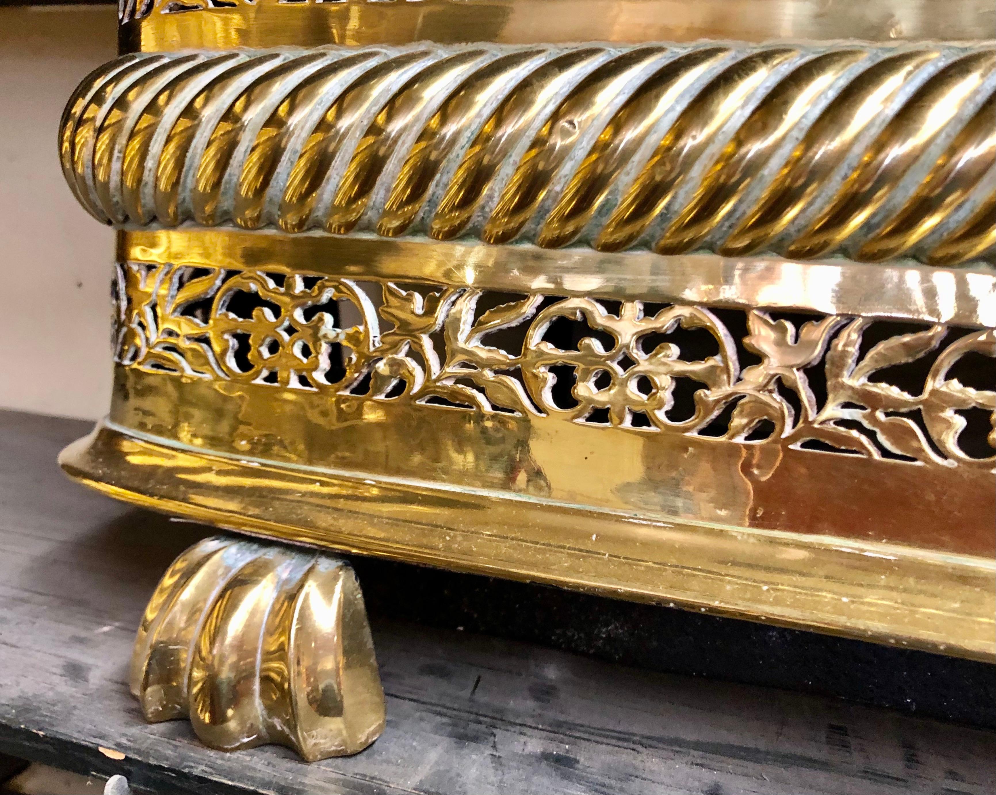 Hand-Crafted Extraordinary Antique English Geo. III Pierced Brass Footed Fireplace Fender For Sale