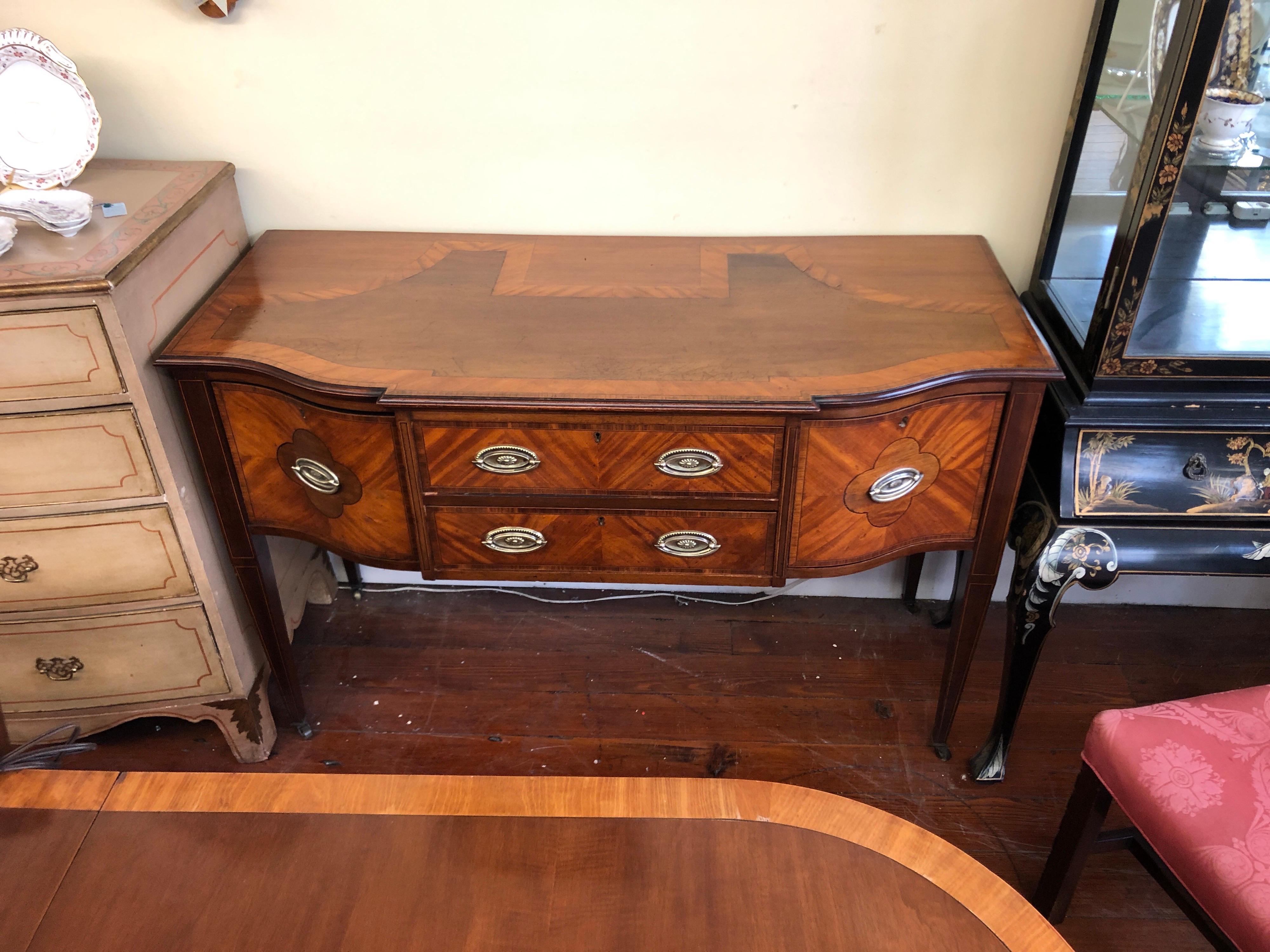 Extraordinarily fine mid 19th century Antique English Hepplewhite style Server or small Sideboard having its original oval brasses and original brass casters. It has a most unusual marquetry inlaid top with the primary wood overall being satinwood,