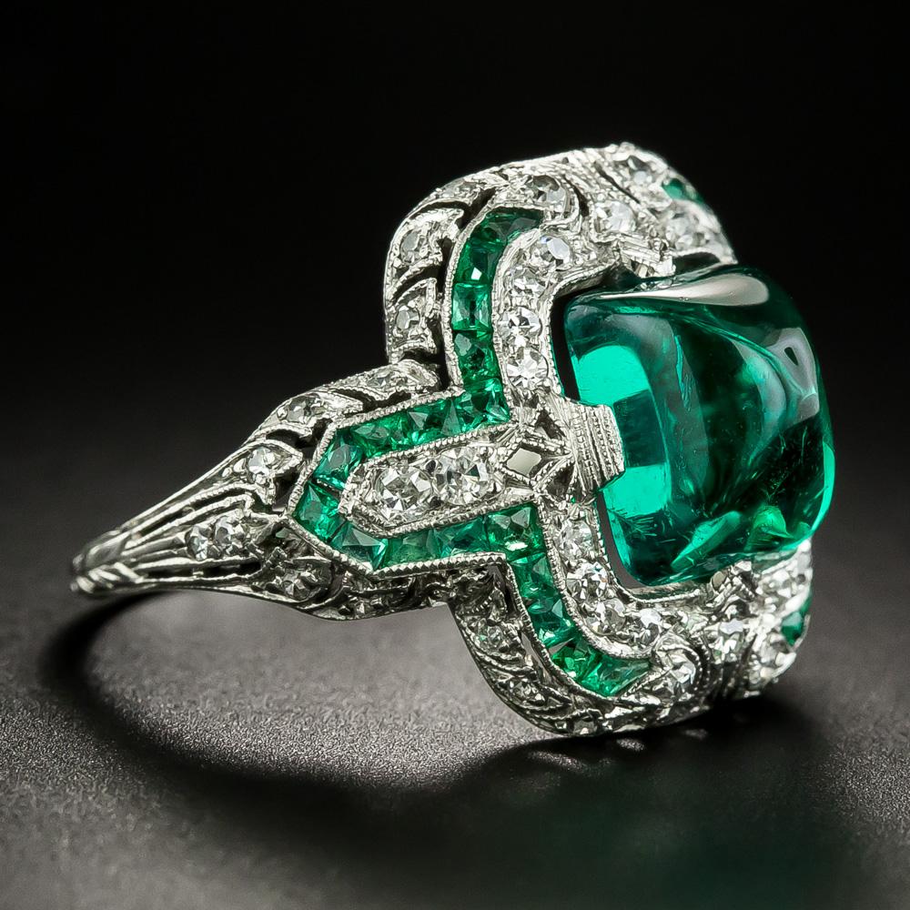 Simply one of the finest original Art Deco cabochon emerald rings of all time! A magnificent sugarloaf shape Colombian emerald, weighing 3.50 carats (showing all on top), suffused with a fabulous, glowing, crystalline (diamond clean) rich green