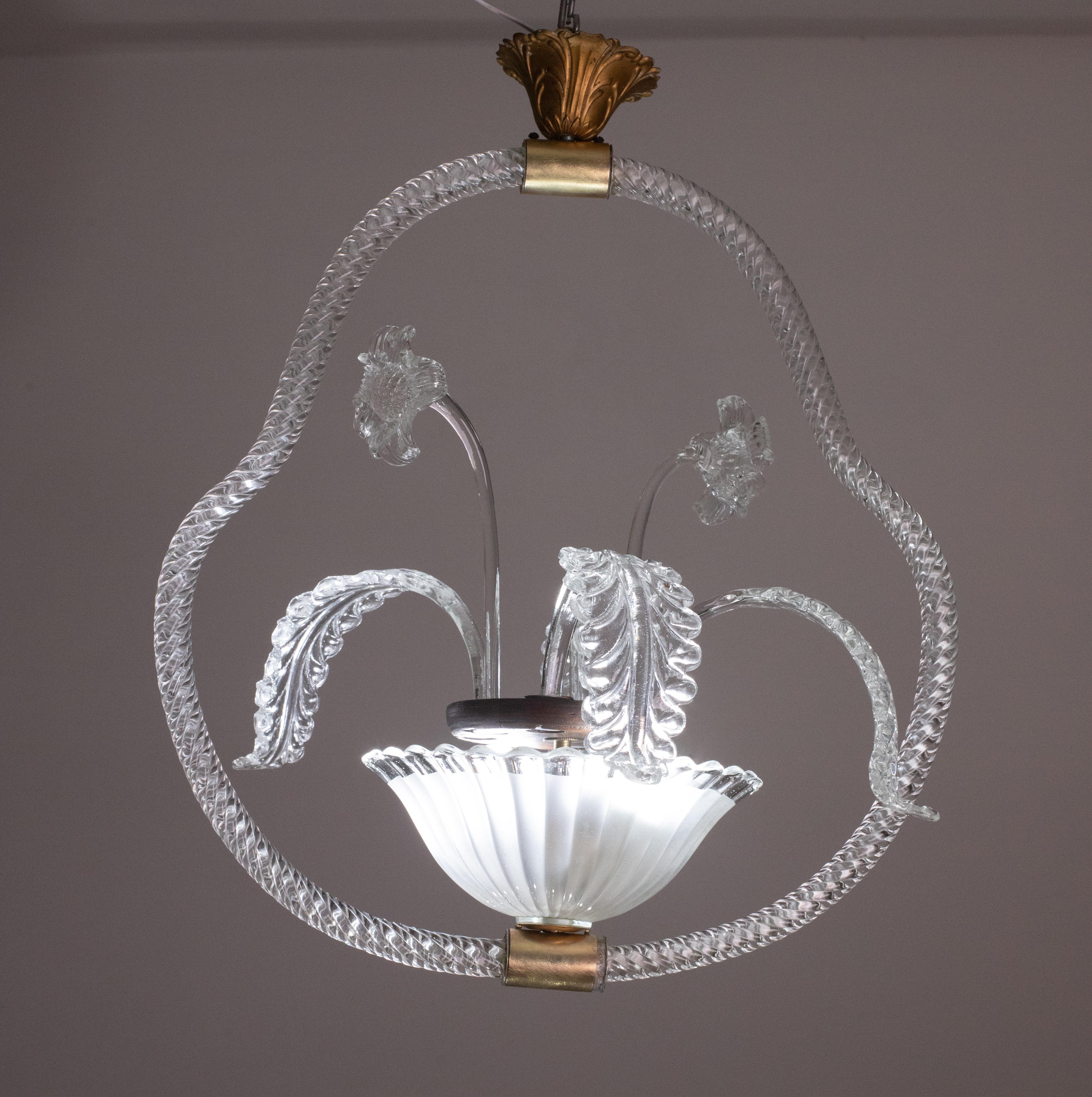 Splendid Murano chandelier made by the Barovier e Toso glassworks in the 1940s, rich of flowers and leaves.

The chandelier measures 55 cm in height and 45 in diameter.

Fits 2 lights.