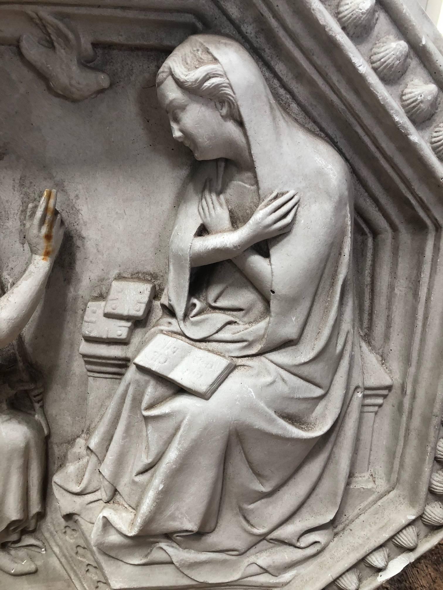 Purchased in Avignon France, this is a lovely bas relief sculpture from a Belgian castle depicting The Annunciation to the Blessed Virgin Mary. The Angel Gabriel is on bended knee as he speaks to Mary, and the Holy Spirit descends in the form of a