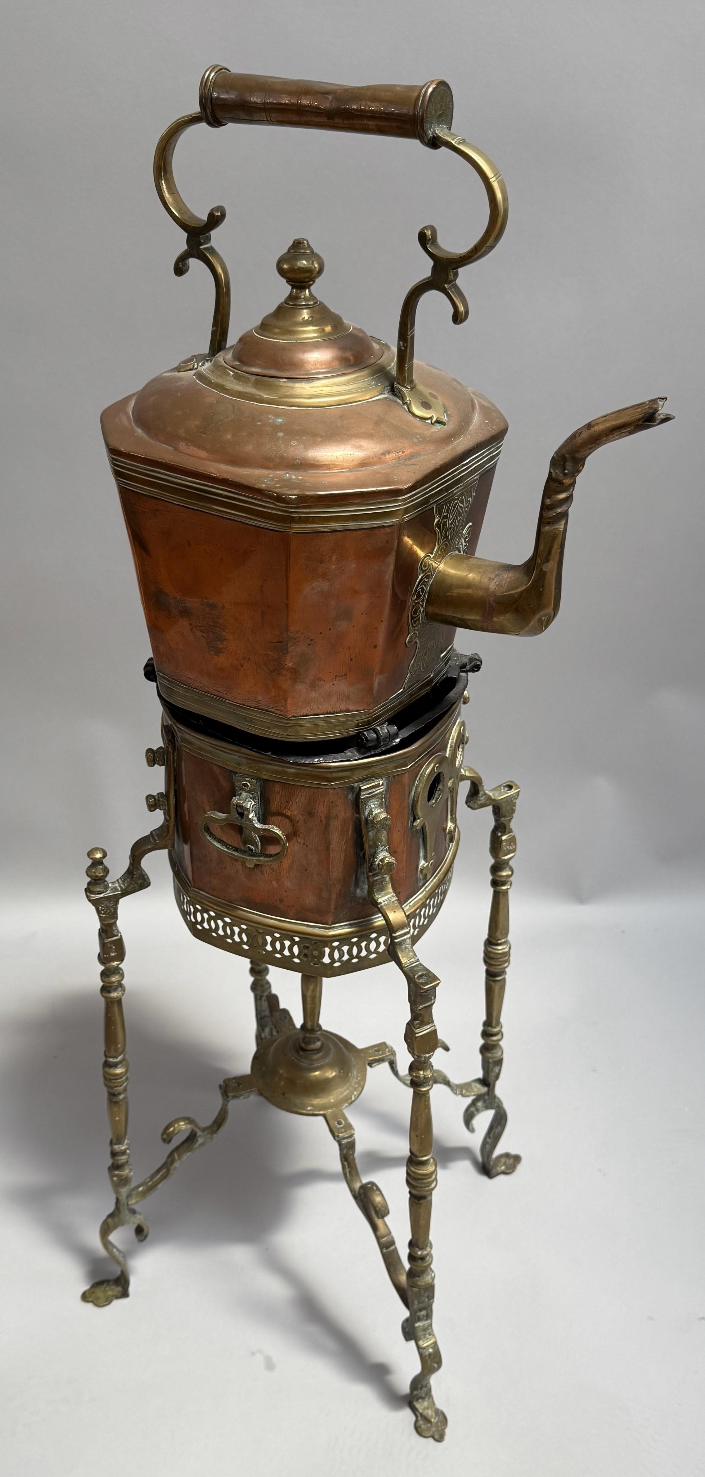 Exceptionally well crafted, it is made of copper and brass and has a compartment in the very decorative stand for charcoal to keep the kettle warm. It is very elegant for domestic use and was made in India circa 1830.