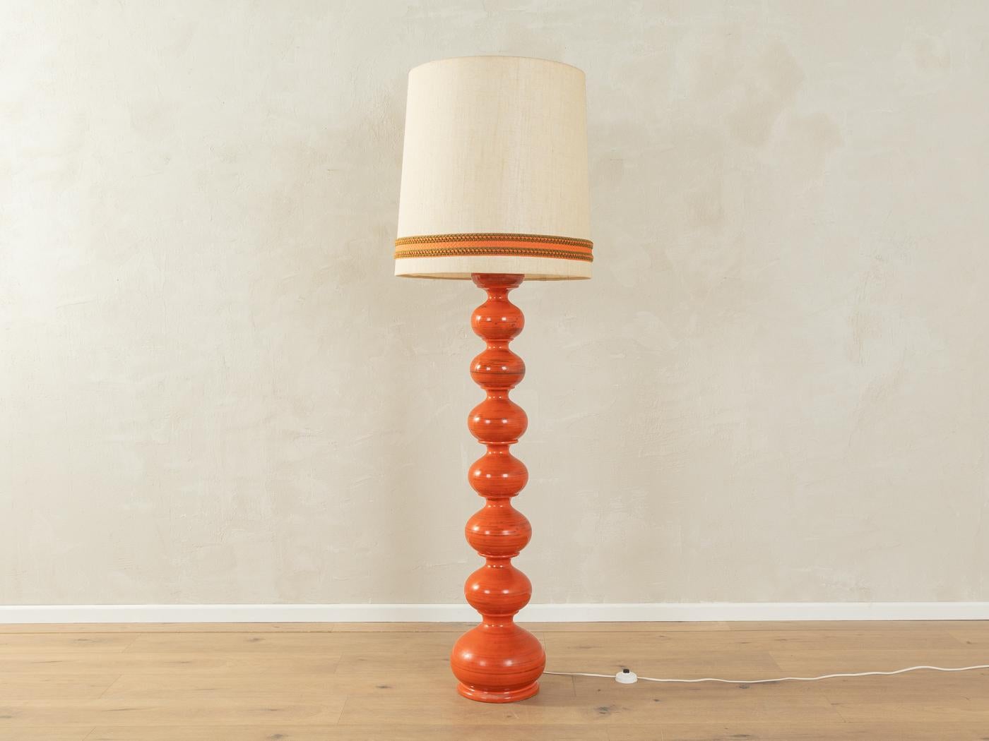 Extraordinary ceramic-bubble floor lamp by Kaiser Leuchten from the 1960s. Handcrafted glazed ceramic base in orange tones with a off-white silk lampshade.

Quality Features:

    very good workmanship
    high-quality materials
    Made in Germany,
