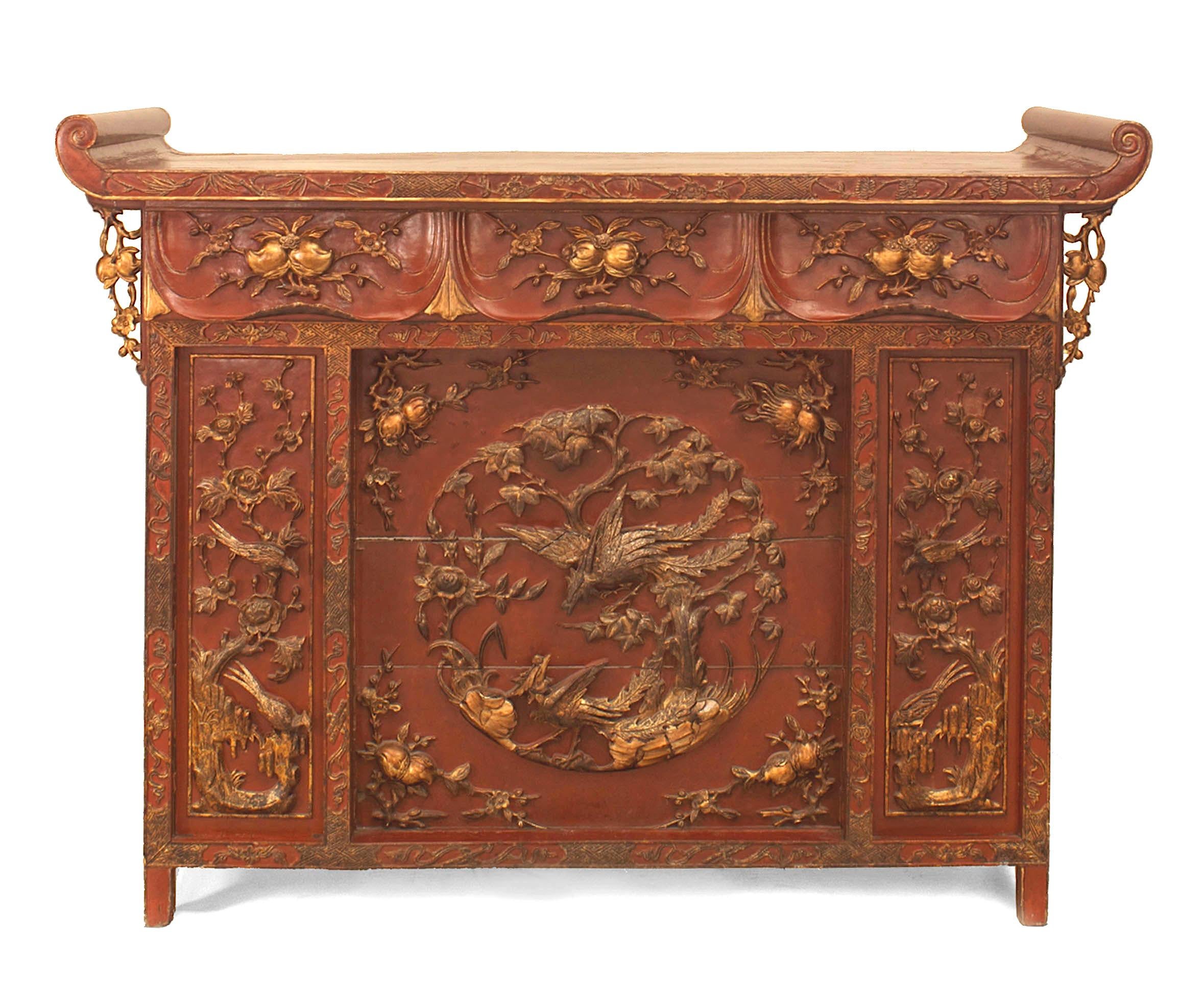Asian Chinese (Possibly Vietnamese 19th Century) red lacquered and gilt carved console (alter) table with scroll top sides and 3 front panels with carved floral and bird design.
