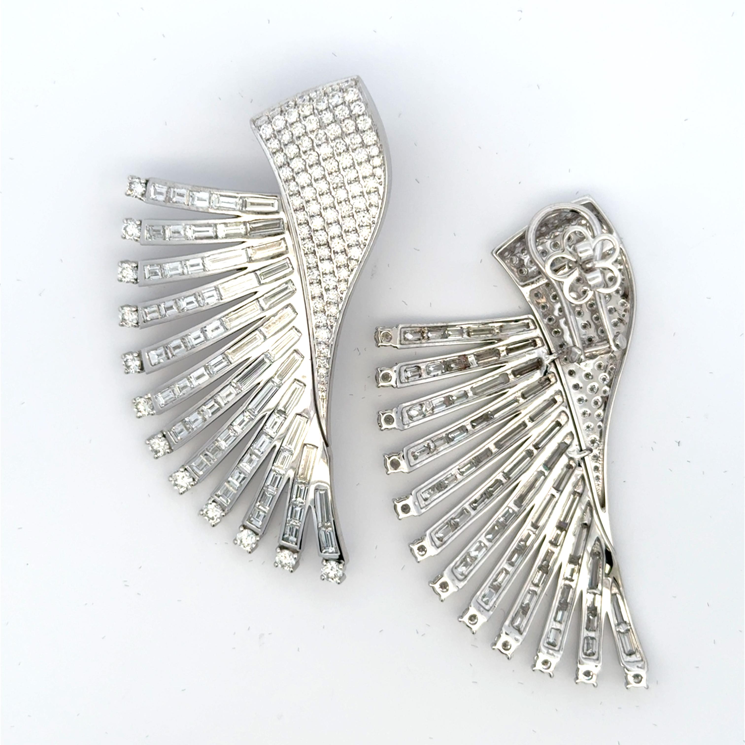 Extraordinary chandelier-style dangling diamond earrings are a stunning example of opulence and glamour. Designed to make a statement, the earrings feature an intricate arrangement of diamonds that cascade in multiple tiers, creating a breathtaking