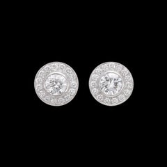 Extraordinarios pendientes de platino con aureola de diamantes