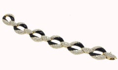 Außergewöhnliches Gliederarmband aus Gelbgold mit Diamanten, Onyx und Gelbgold