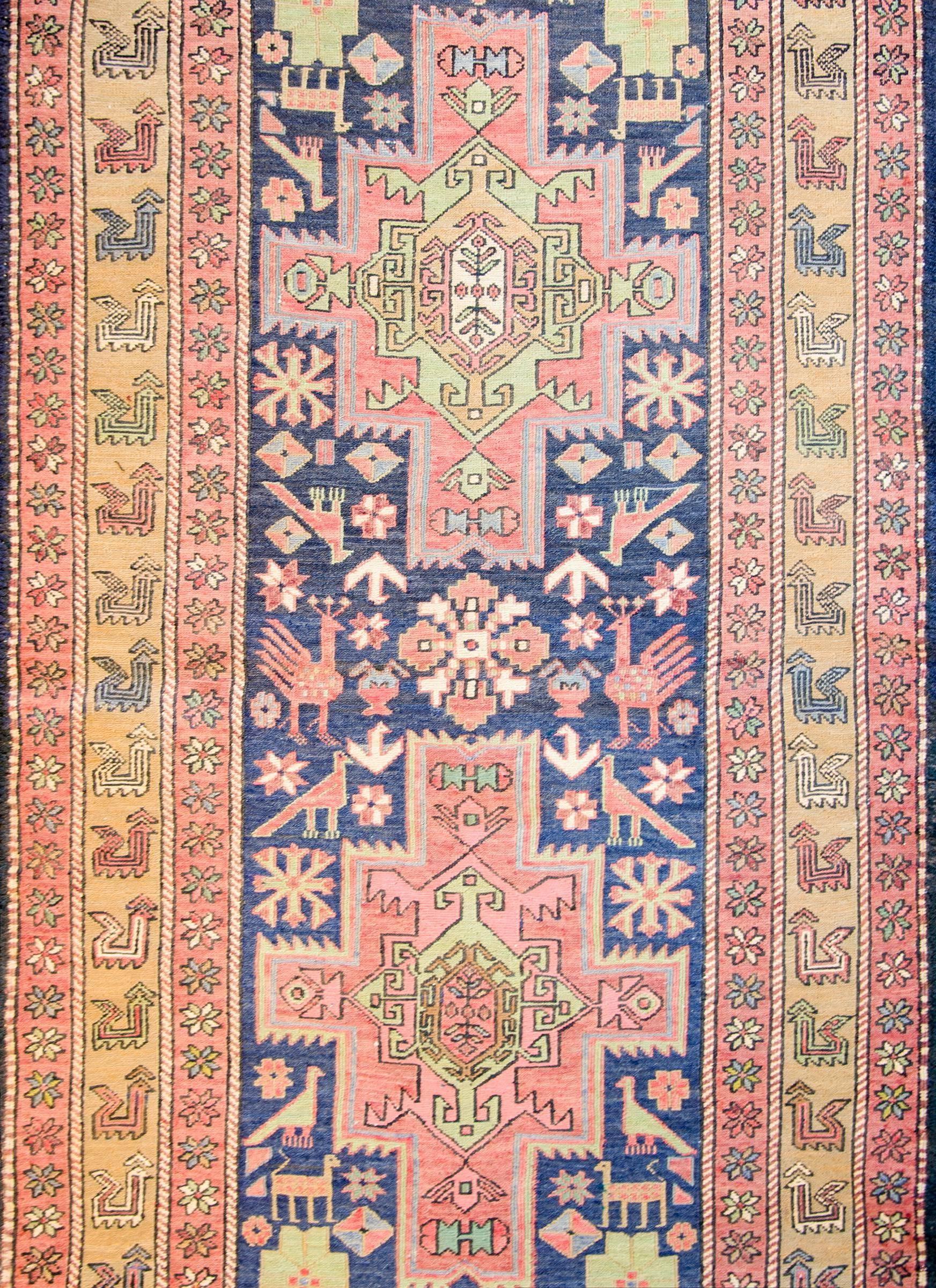 A wonderful late 19th century Persian Sumak Azeri rug with four large medallions depicting stylized flowers, amidst a field of tightly woven goats, chickens, birds, and strangely enough, stop signs, all on an indigo border. The border contains a