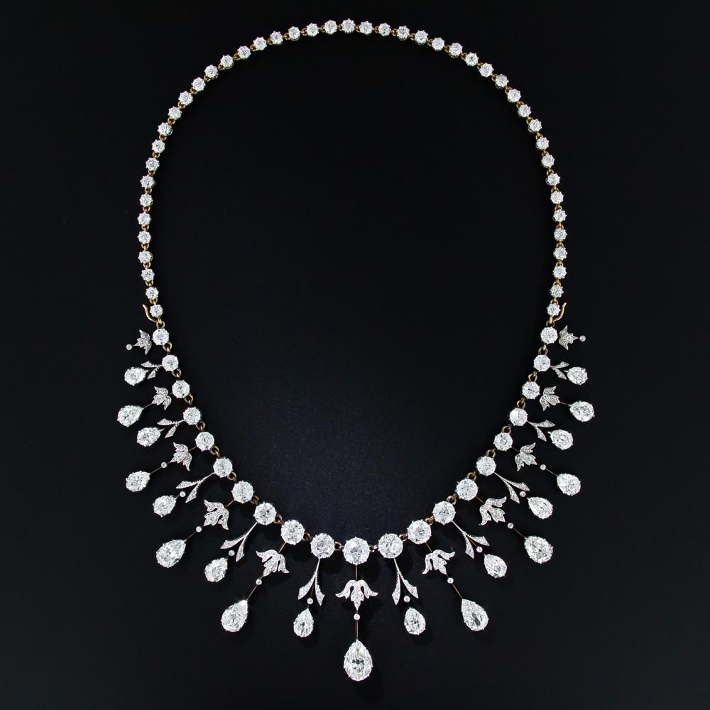We are thrilled to present this rare, regal and altogether sublime antique diamond necklace. A masterpiece of Edwardian craftsmanship - circa 1900 - hand-fabricated in platinum over 18 karat gold, with 35.00 carats of well-matched, bright-white and