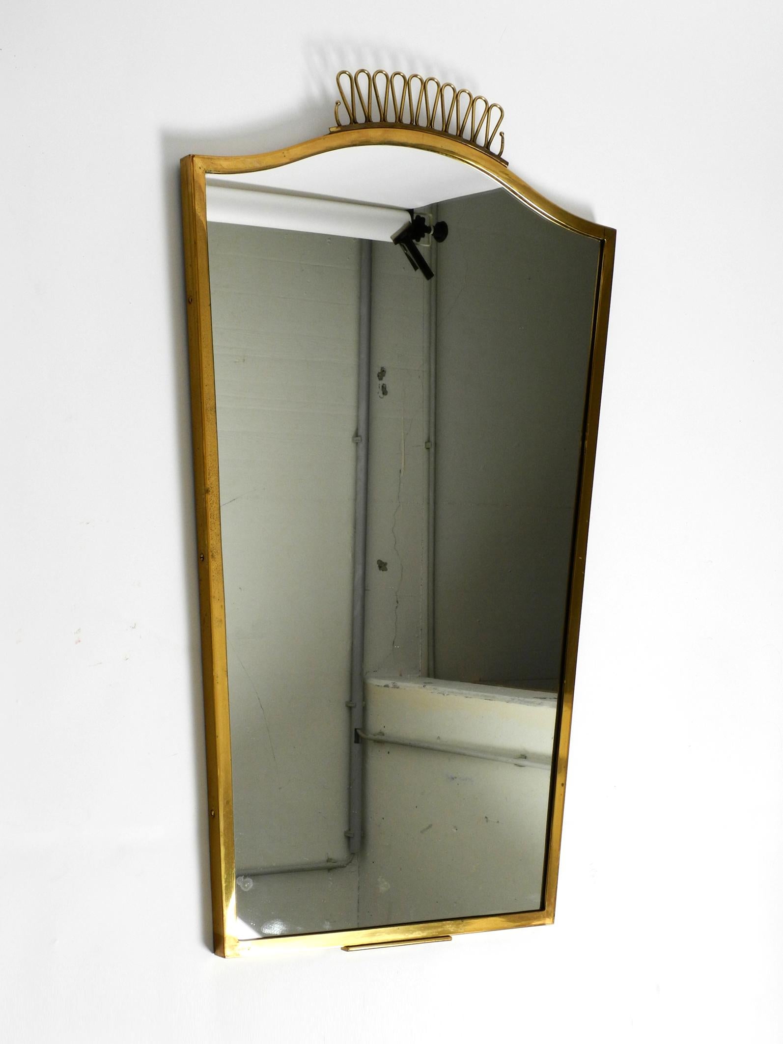 Mid-Century Modern Extraordinary, elegant, large, heavy, Mid Century brass wall mirror For Sale