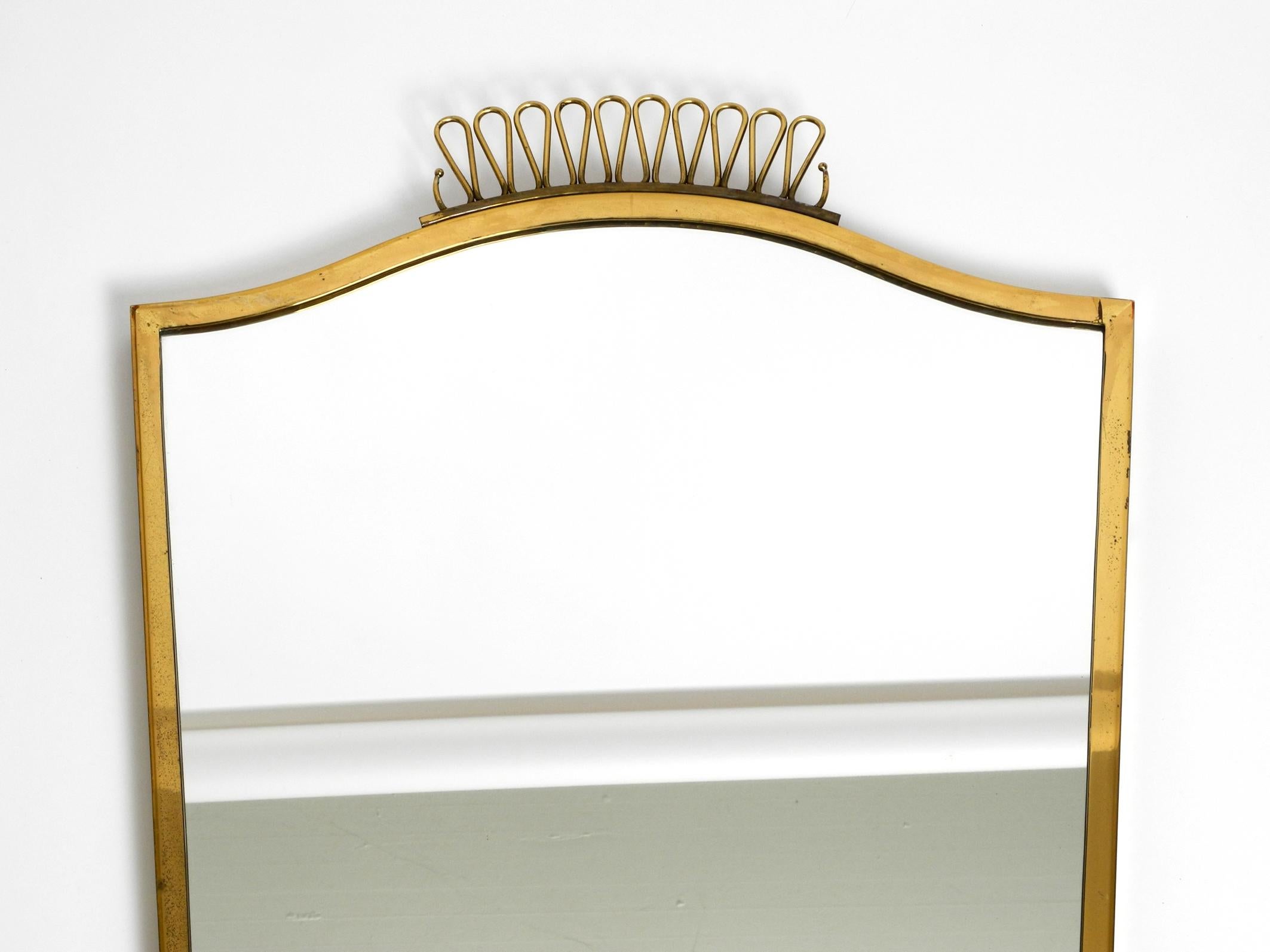 Mid-20th Century Extraordinary, elegant, large, heavy, Mid Century brass wall mirror For Sale