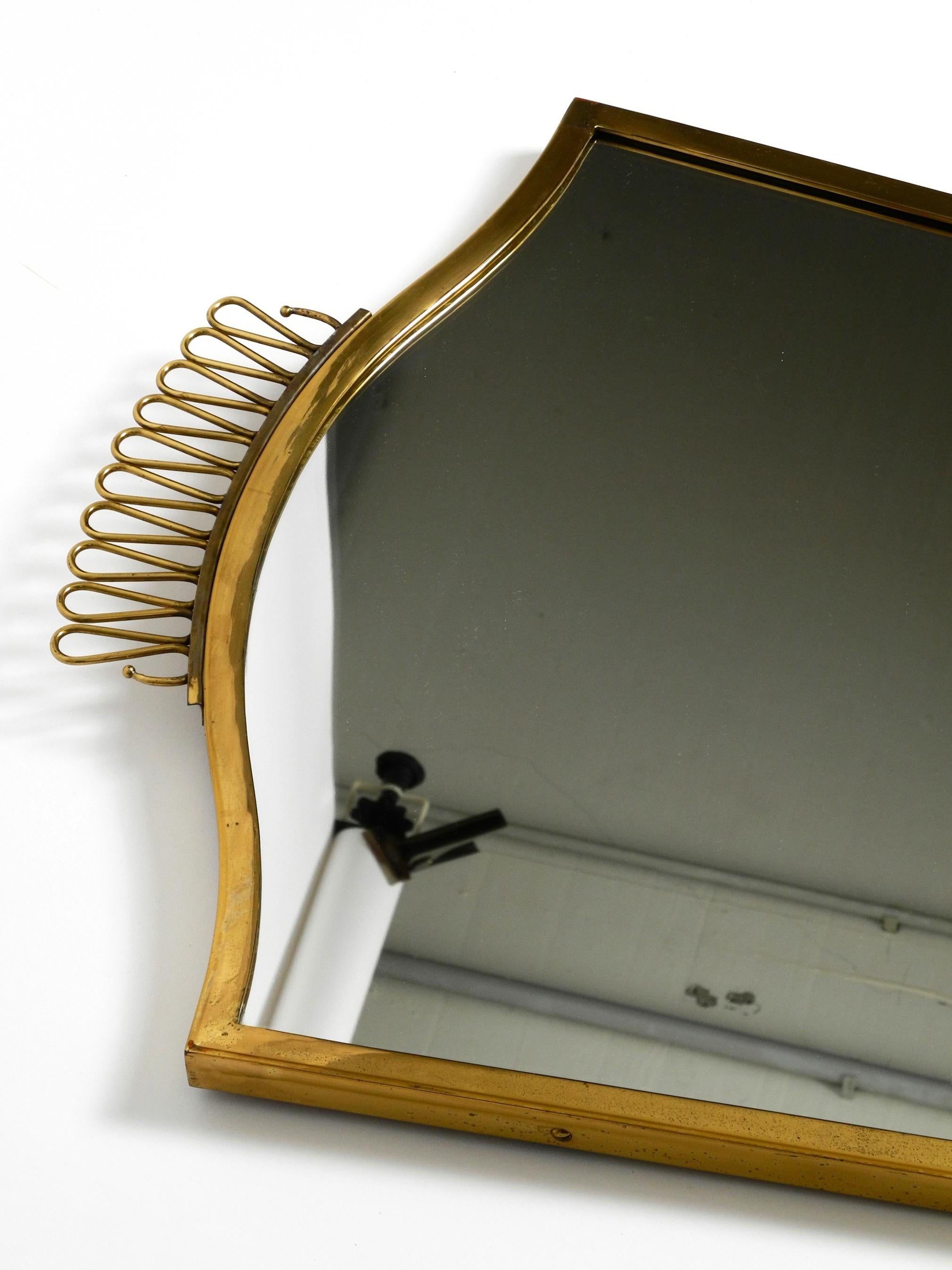 Brass Extraordinary, elegant, large, heavy, Mid Century brass wall mirror For Sale