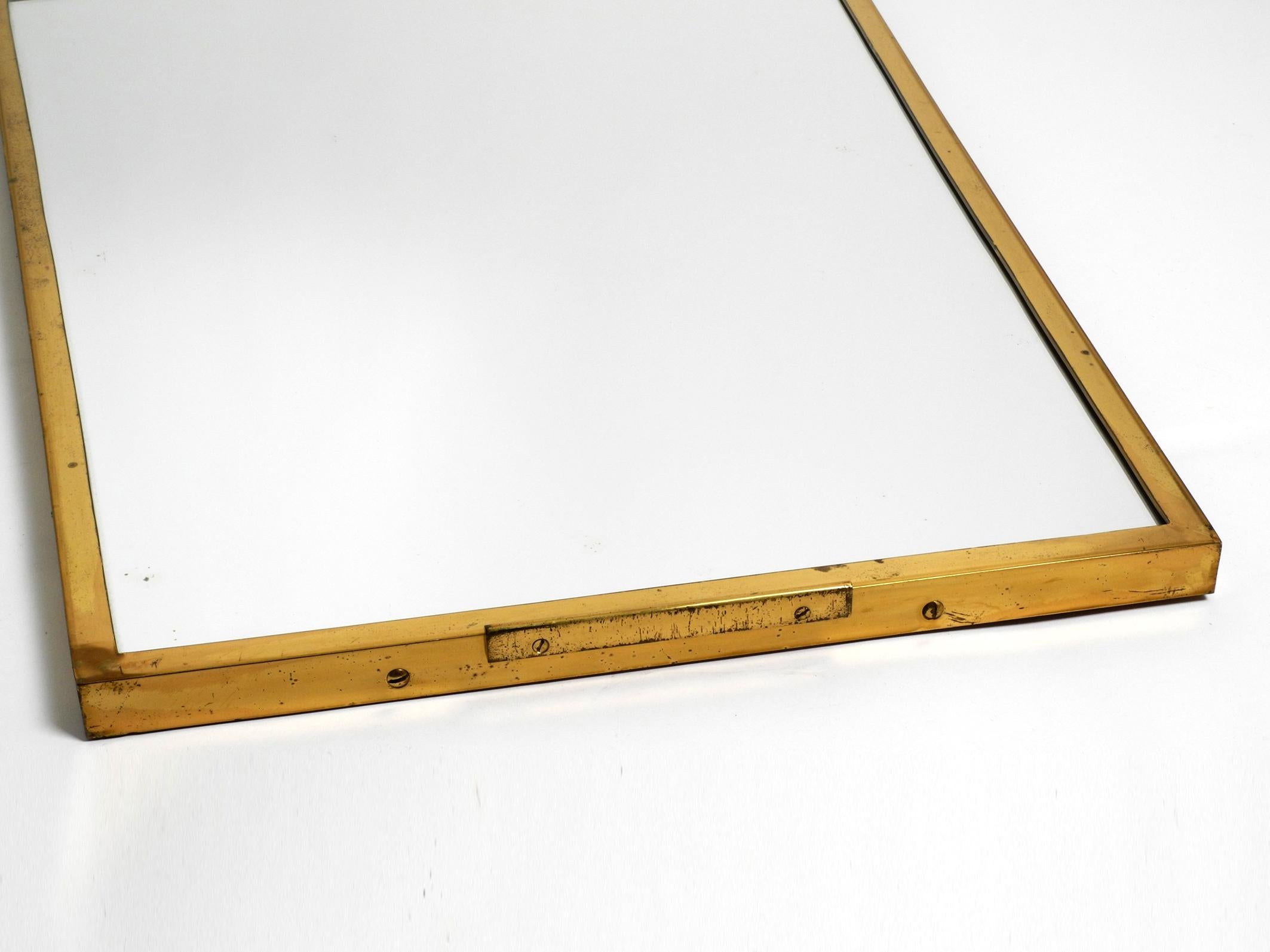 Extraordinary, elegant, large, heavy, Mid Century brass wall mirror For Sale 2