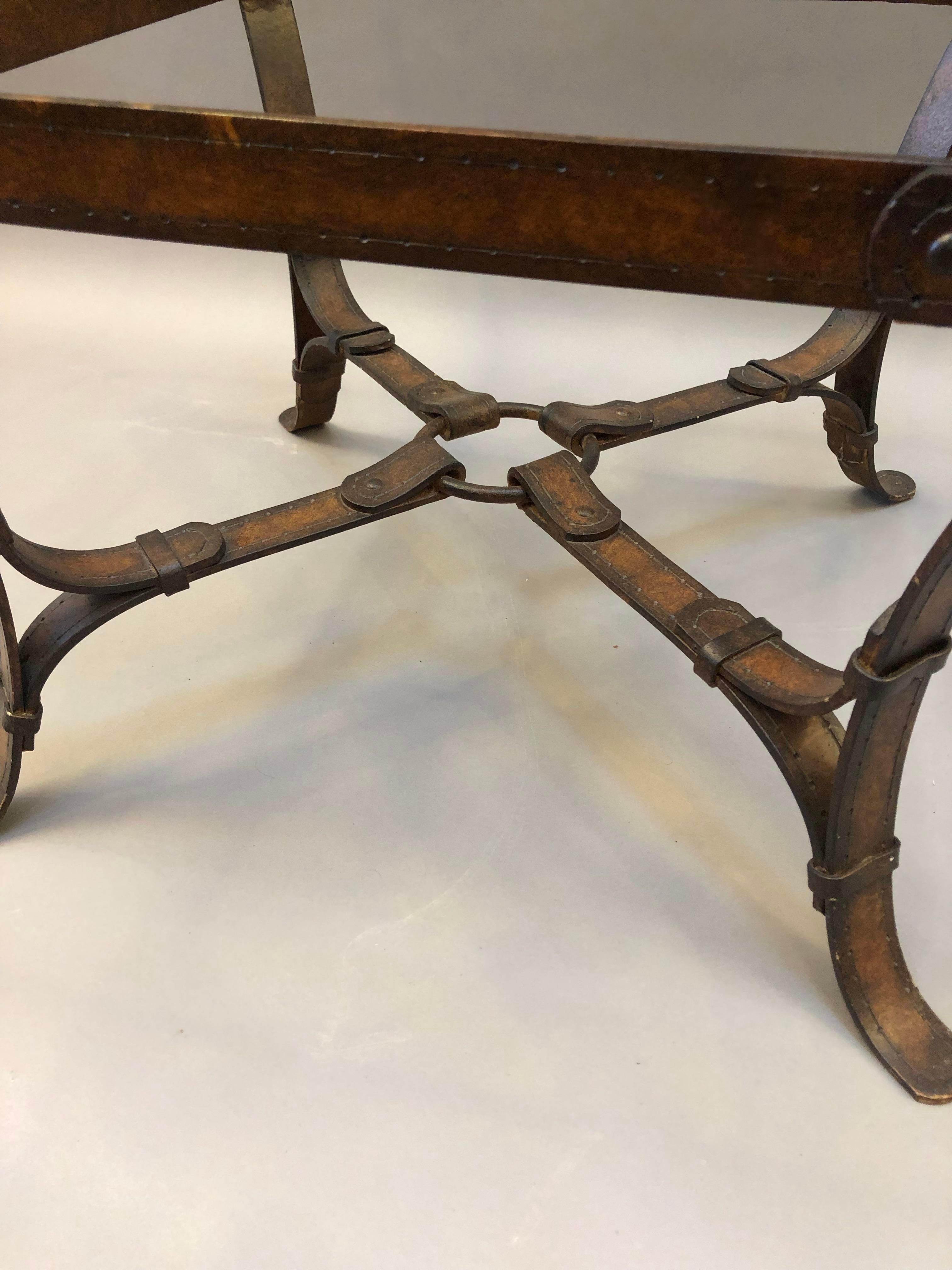 Extraordinary Equestrian Style Iron and Glass Side Table.  With Curving  “Faux Leather Harness Straps” crafted as the main Structure and a thick beveled glass top.  20th Century