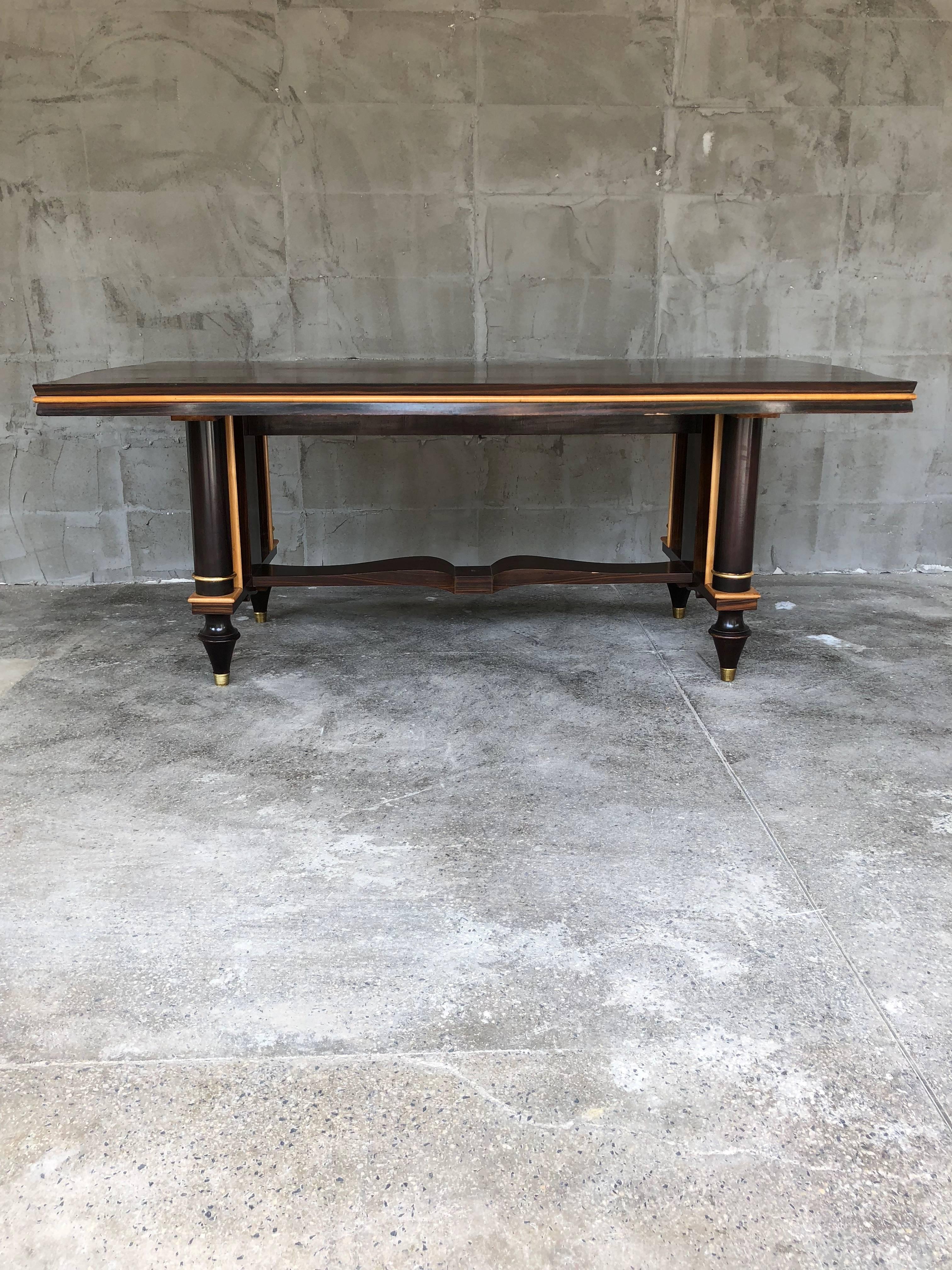 Exceptional and very rare as design French Art Deco dining table. Macassar ebony wood for the external surfaces. Produced in the period of the 1940s in France. The table was set up with same Macassar ebony sideboard. The table is partially restored