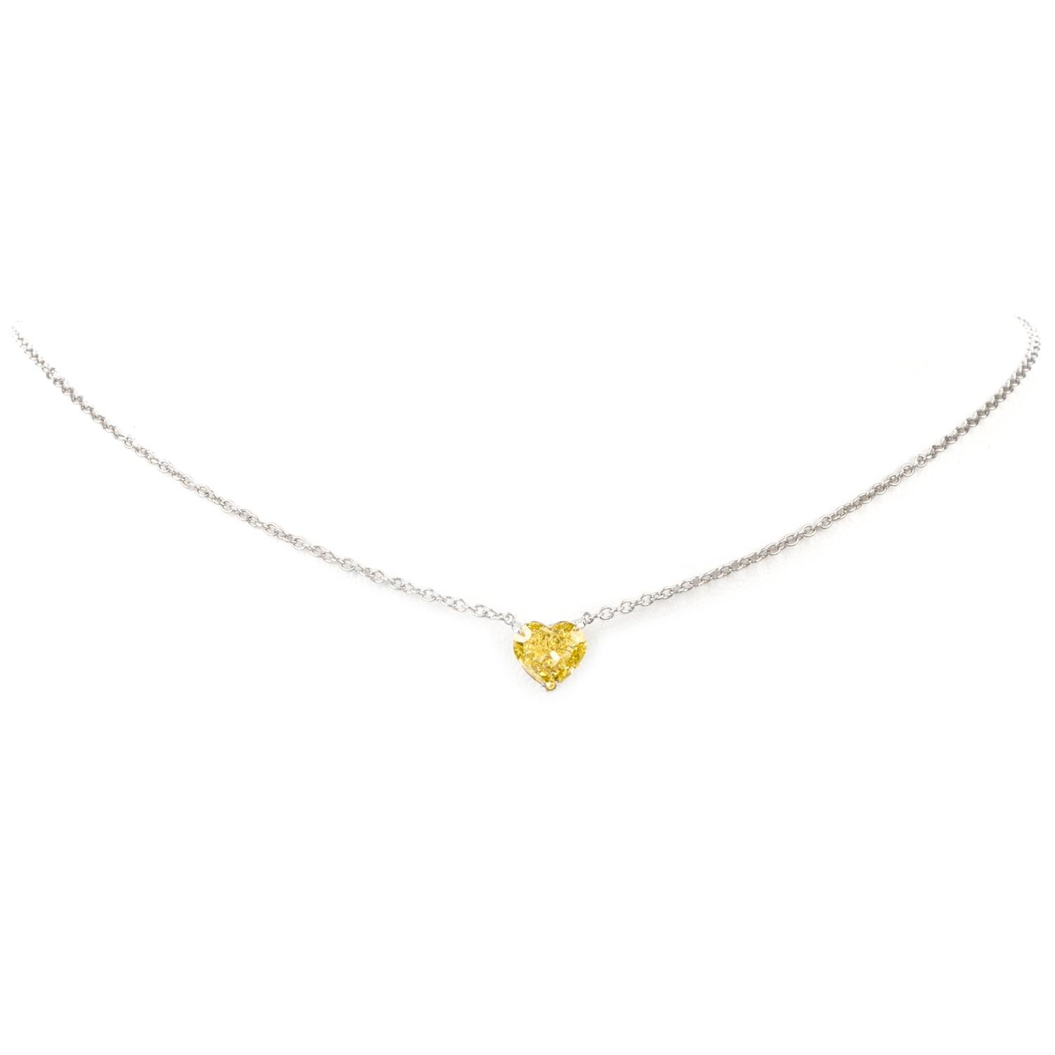 This is an extraordinary expression of love!

Boasting a Natural Fancy Intense Yellow Heart shaped Gia

Certified diamond, this necklace pops with vibrant color.

Attached stationary to the center of this 15.5 inch cable chain.

Heart Diamond