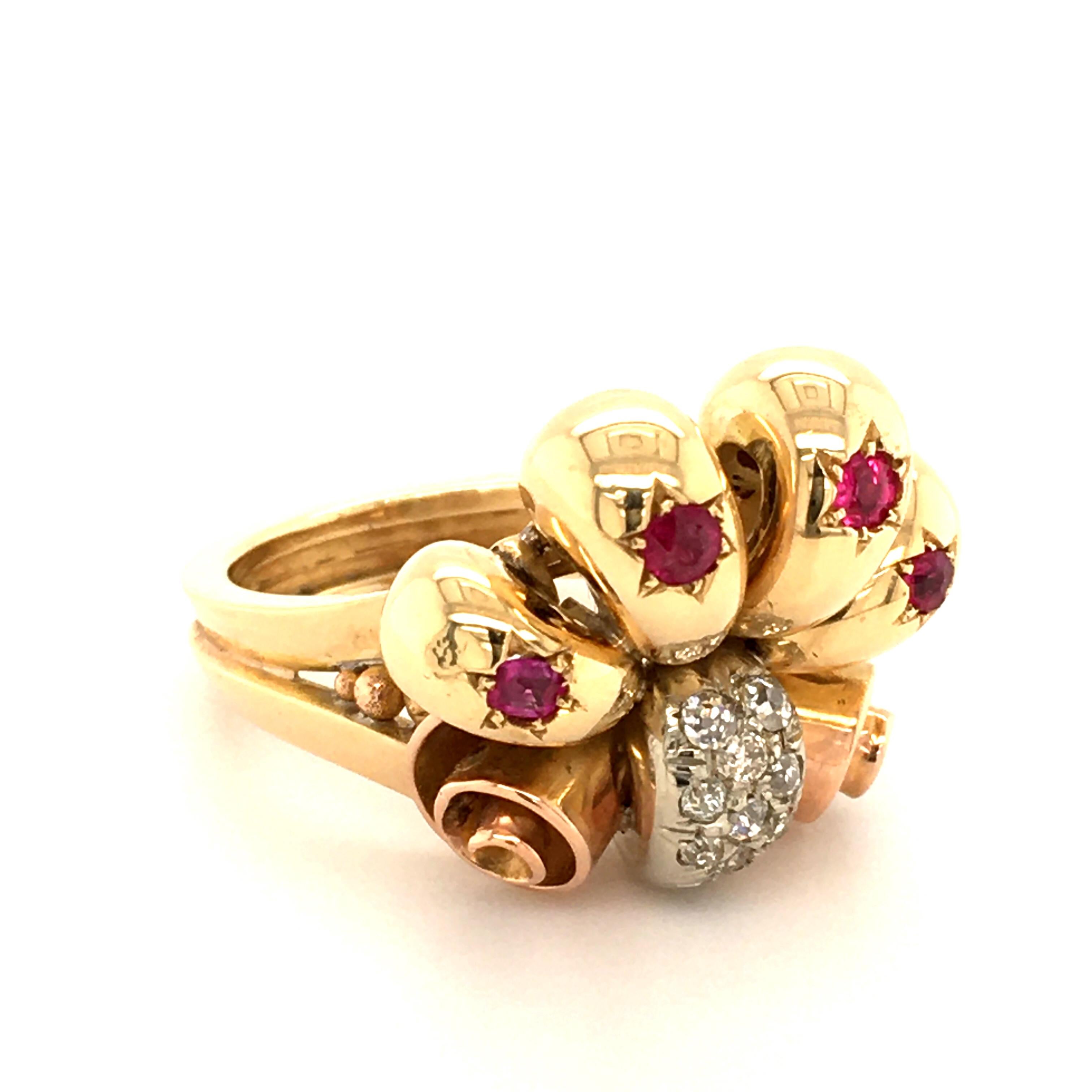 With this out of the ordinary Cocktail Ring you will be the Highlight of every Party.
The Baroque Elements are made of 18 kt Yellow-, Red-, and White Gold.
The White Gold part is set with beautiful Oldcut Diamonds 
The glowing rubies are set in a