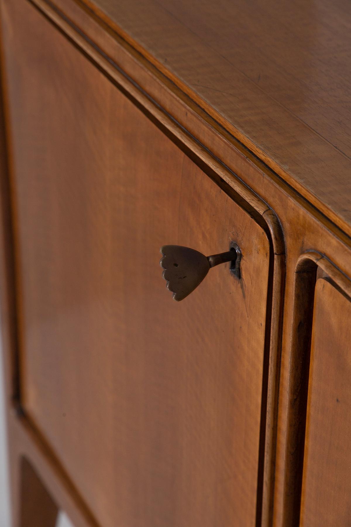 This impressive 1950s Italian sideboard by Paolo Buffa is a remarkable example of fine craftsmanship and sophisticated design, reflecting the elegance and technical mastery of Italian mid-century furniture. With its generous proportions and refined