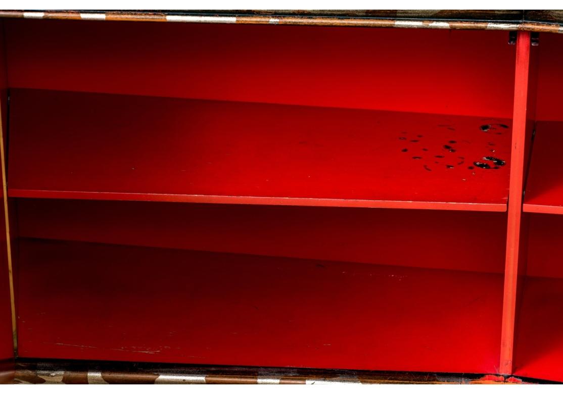 An incredible and rare Cabinet from the iconic and fascinating Mid Century designer James Mont. With an unusual and highly decorative shaped form, the Cabinet is finished in Lacquered Silver Leaf which was laid down in a fashion creating a fantastic